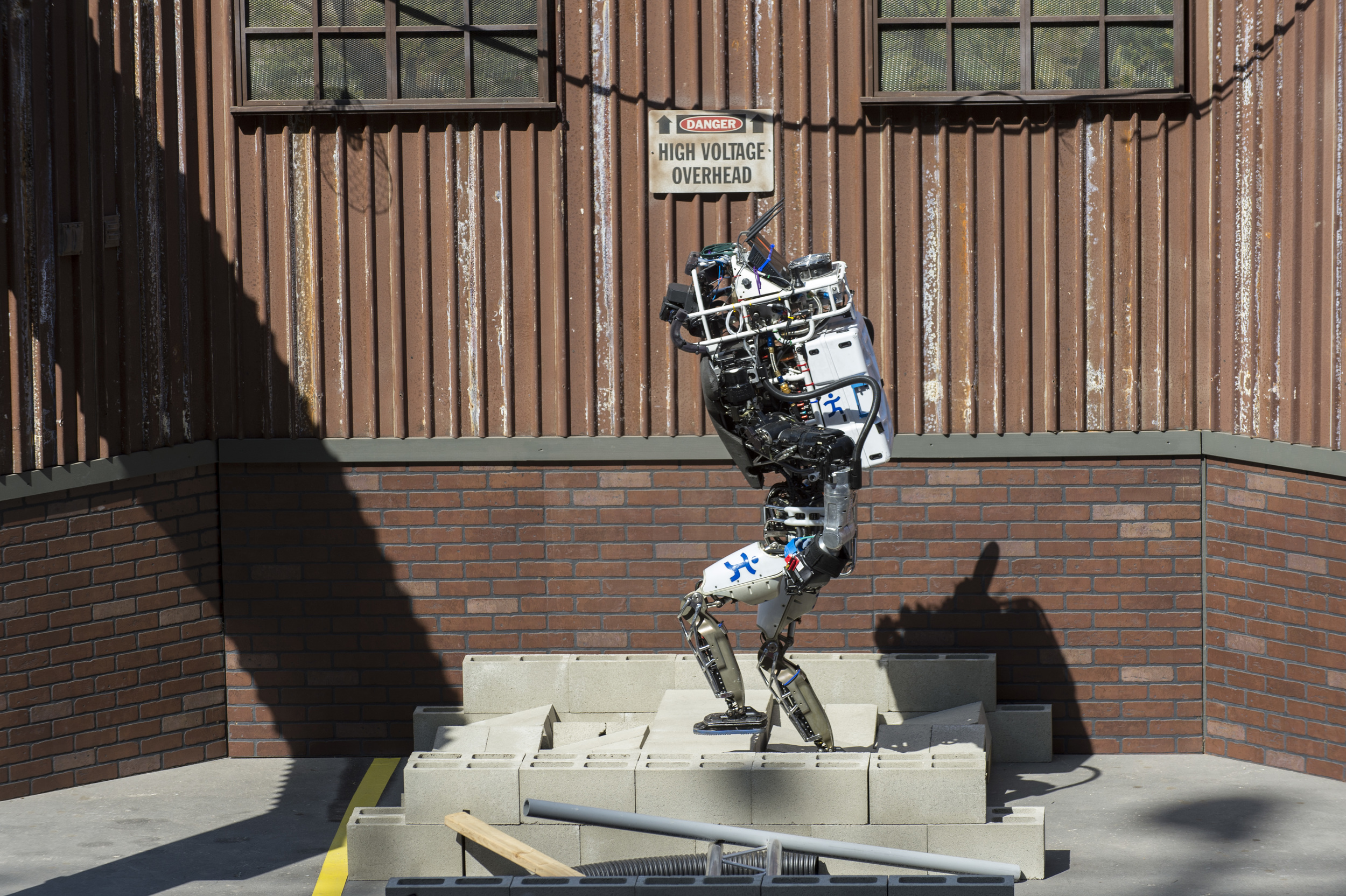   POMONA, Calif.  - A robot from the Institute of Human and Machine Cognition (IHMC) located in Pensacola, Florida, makes its way through the simulated disaster course on its way to a second place finish during the Defense Advanced Research Projects 