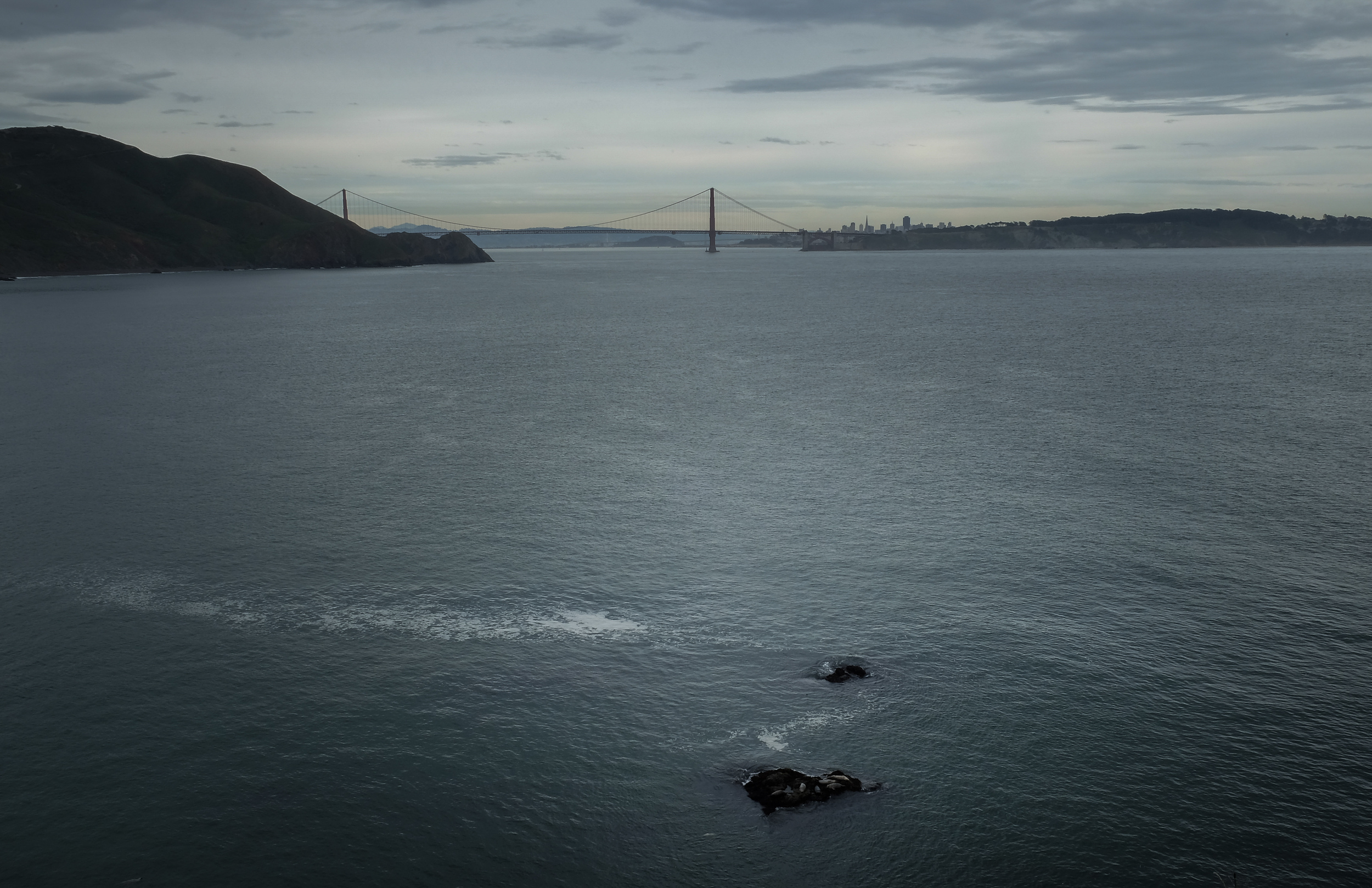 Consider a rental car or Zip car so you can get to locations away from the crowds, like this photograph of the bridge taken from Point Bonita Lighthouse just before sunset. 1/18 @ f22, ISO 200.