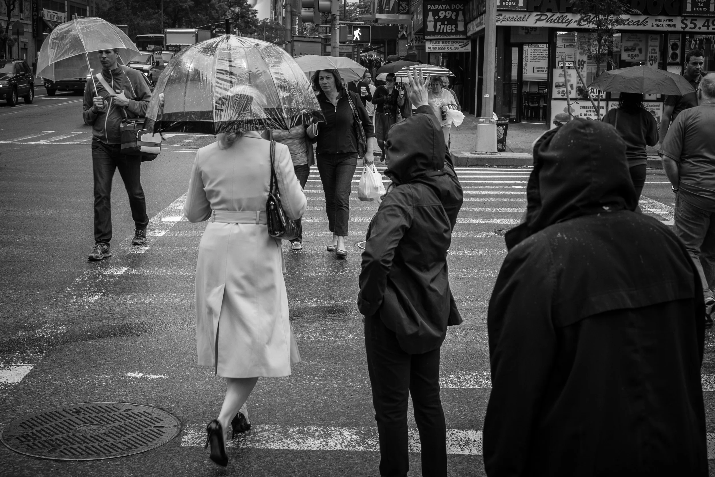 A little bit of rain didn't bother the X-Pro1, but did offer some nice scenes to photograph. When shooting on the streets in large cities, I find crosswalks and street corners offer plenty of opportunities. 1/125, f5.6 at ISO 640.
