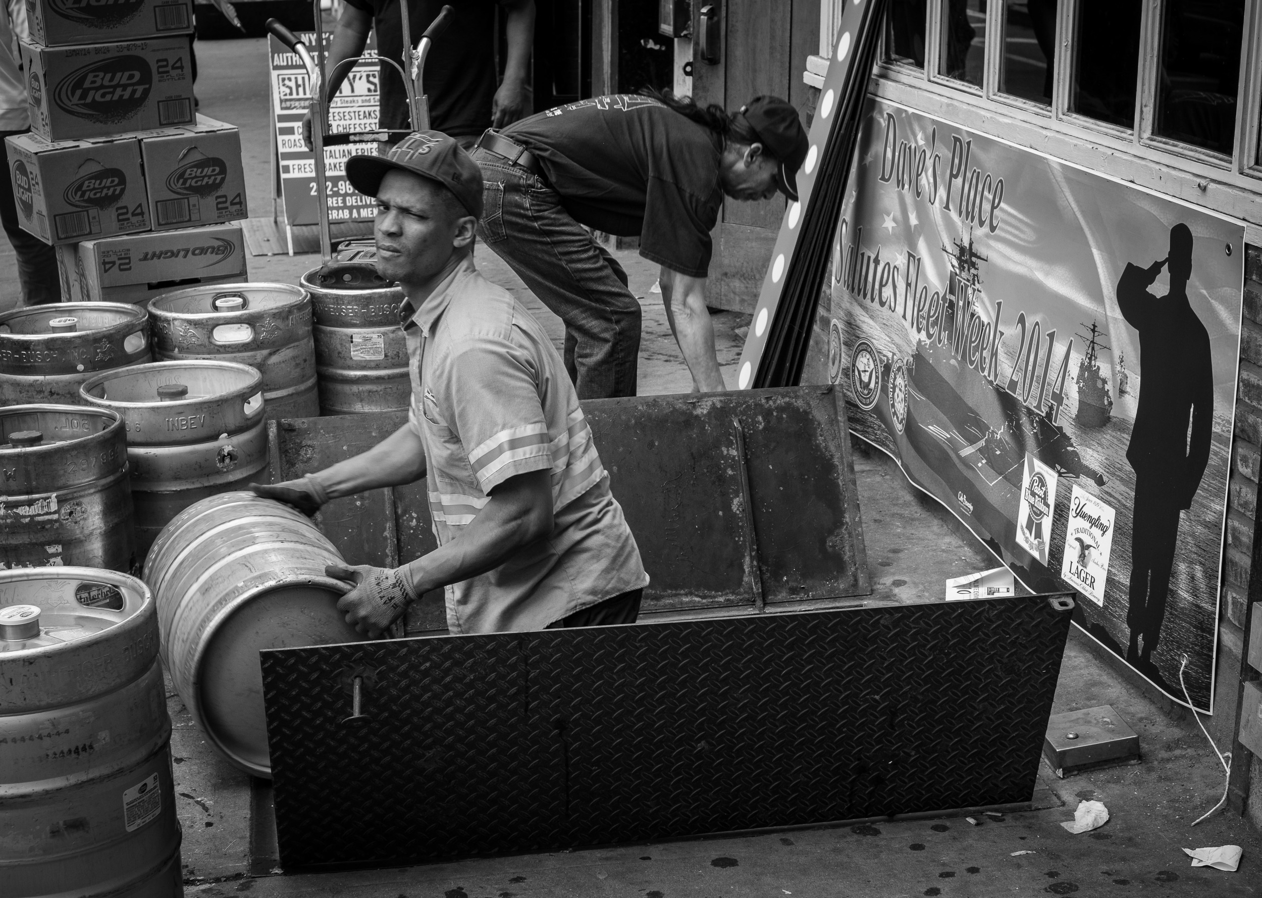 In street photography, you have to always be ready to shoot. In this case I noticed the Fleet Week sign and the man loading kegs as I walked by. I quickly turned and got off about a dozen frames before I moved on. 1/125, f5.6 at ISO 500.