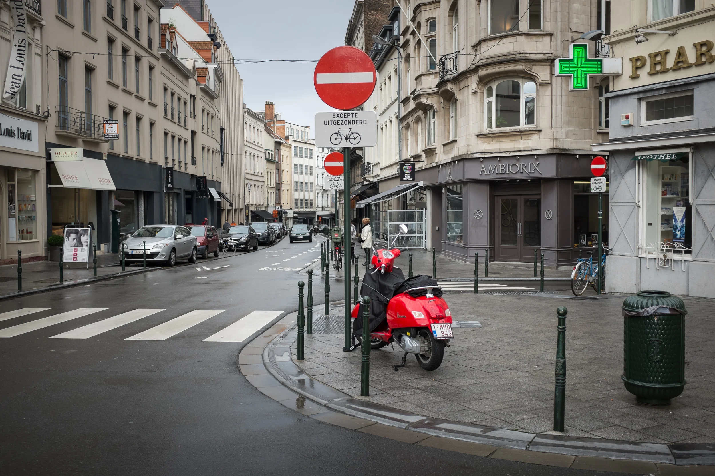 Red scooter and sign in Brussels, Belgium.