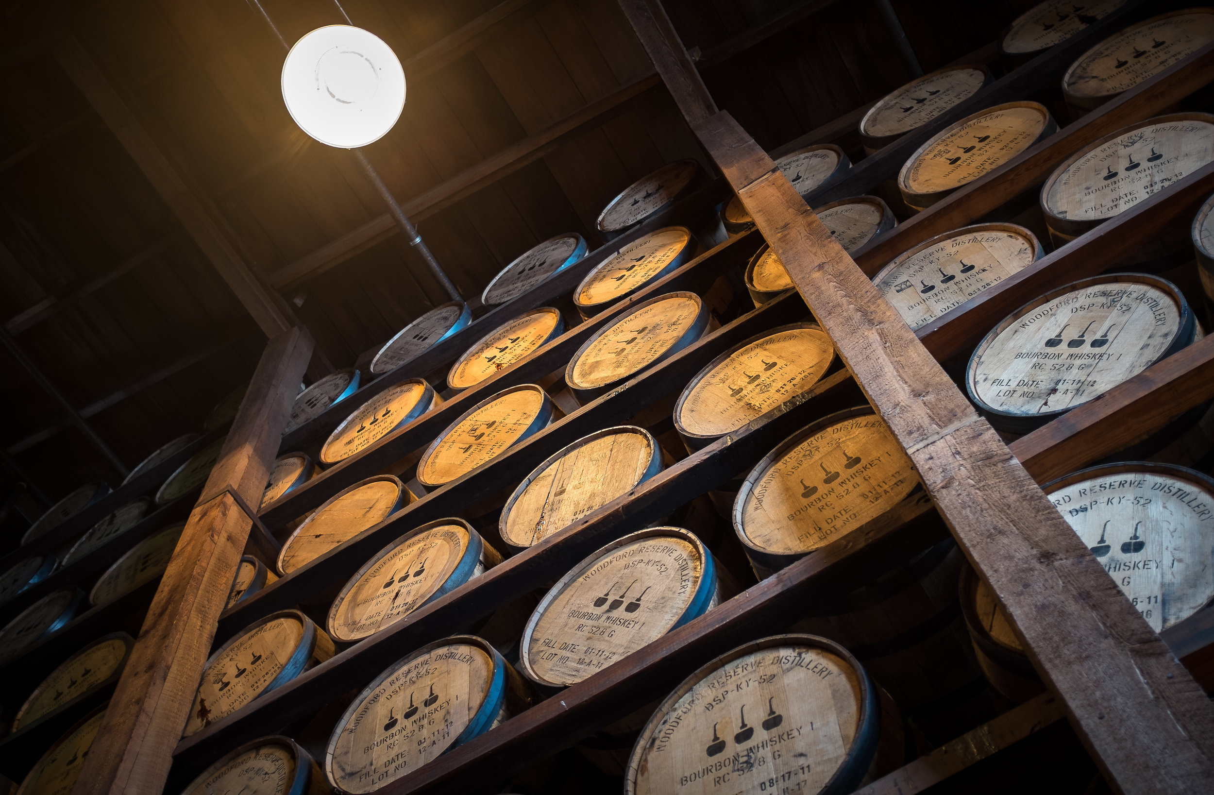 Bourbon barrels aging at Woodford Reserve. 1/15 @ f2.0, ISO 400.