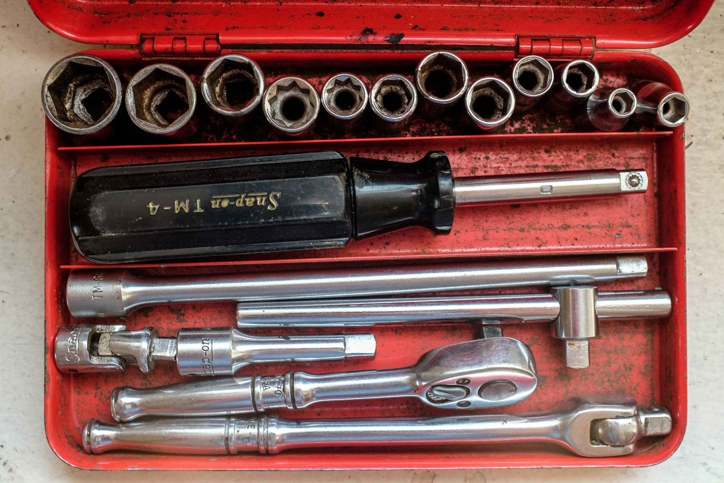 My late Grandfather's Snap-on socket set shot at 1/25, f4.5 at ISO 200, macro setting.
