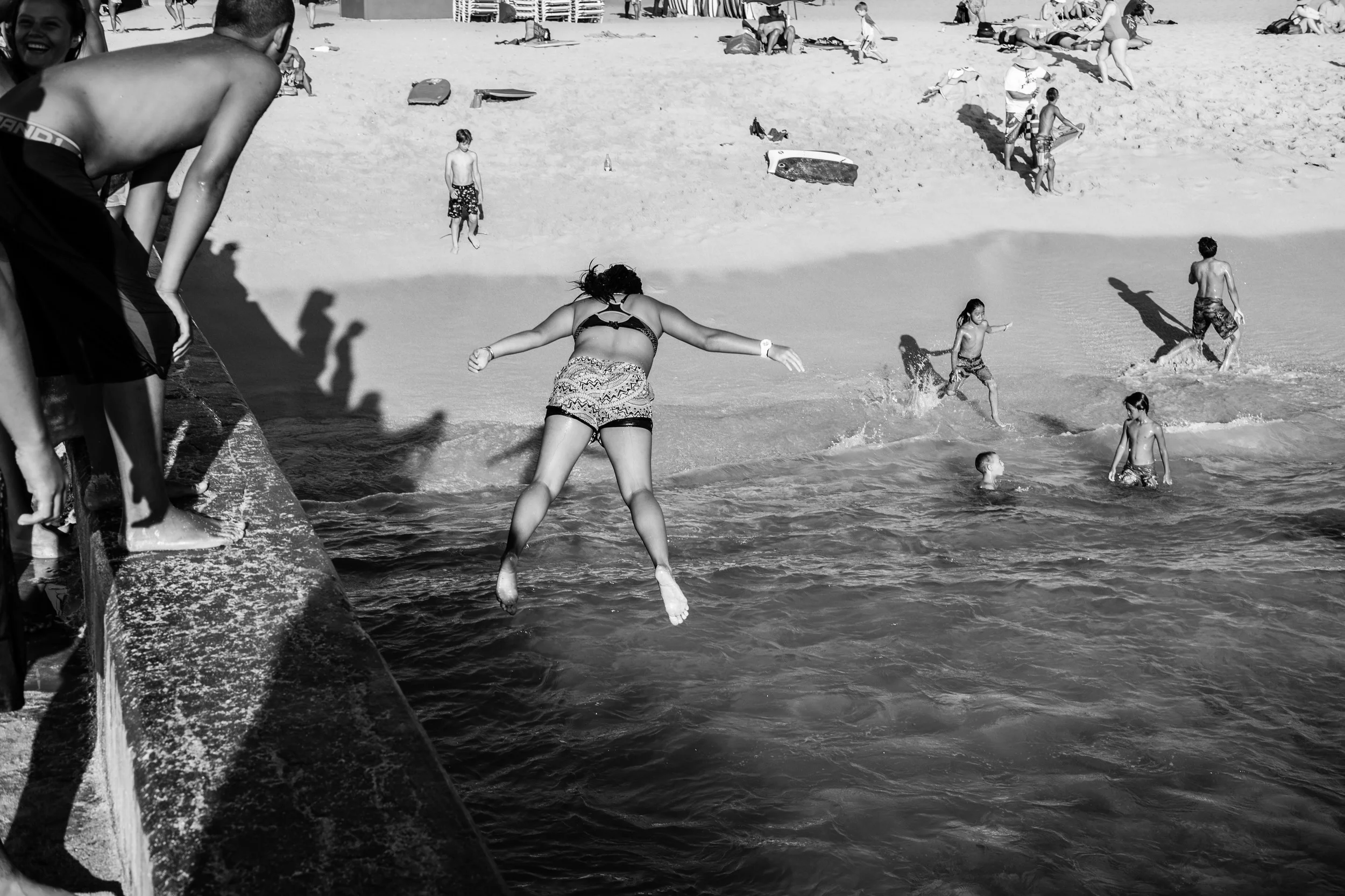 On the first day as I wandered around Waikiki Beach trying to overcome some jet lag, I came across these kids being kids. I watched for a little bit before taking any photos and while they were aware I was there, they soon just went back to timing the surf and leaping from the pier. I liked this photo best because while most of these kids jumped feet first, this girl just went for it. 1/680 @ f5.6, ISO 200.