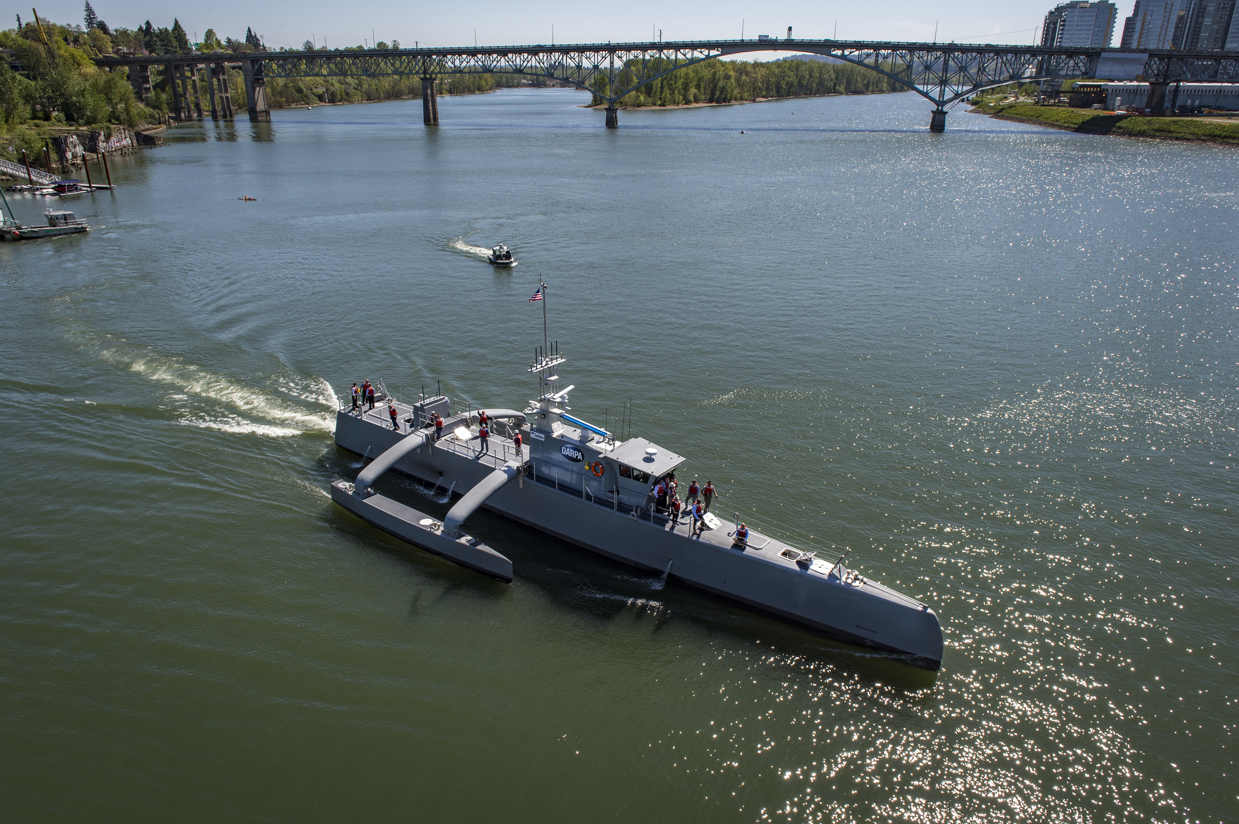 PORTLAND, Oregon - Sea Hunter, an entirely new class of unmanned ocean-going vessel gets underway on the Williammette River following a christening ceremony in Portland, Oregon. Part the of the Defense Advanced Research Projects Agency (DARPA)'s Anti-Submarine Warfare Continuous Trail Unmanned Vessel (ACTUV) program, in conjunction with the Office of Naval Research (ONR), is working to fully test the capabilities of the vessel and several innovative payloads, with the goal of transitioning the technology to Navy operational use once fully proven.