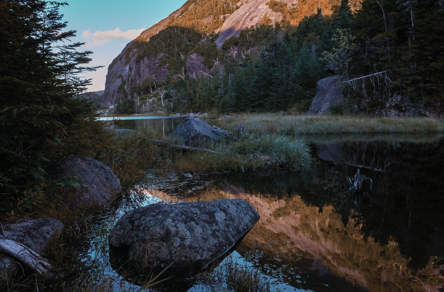 I knew that I would not be able to capture the sunset unless I hiked back to the other side of the lake. and that wasn't going to happen. But the great late afternoon light coming from behind and skimming the tops of the mountains on either side of the lake added a nice warm color reflection and made the photograph. Fujifilm X-Pro2 with 16mm lens, 1/60 @ f11, ISO 800, Exp. Comp. -1.3.