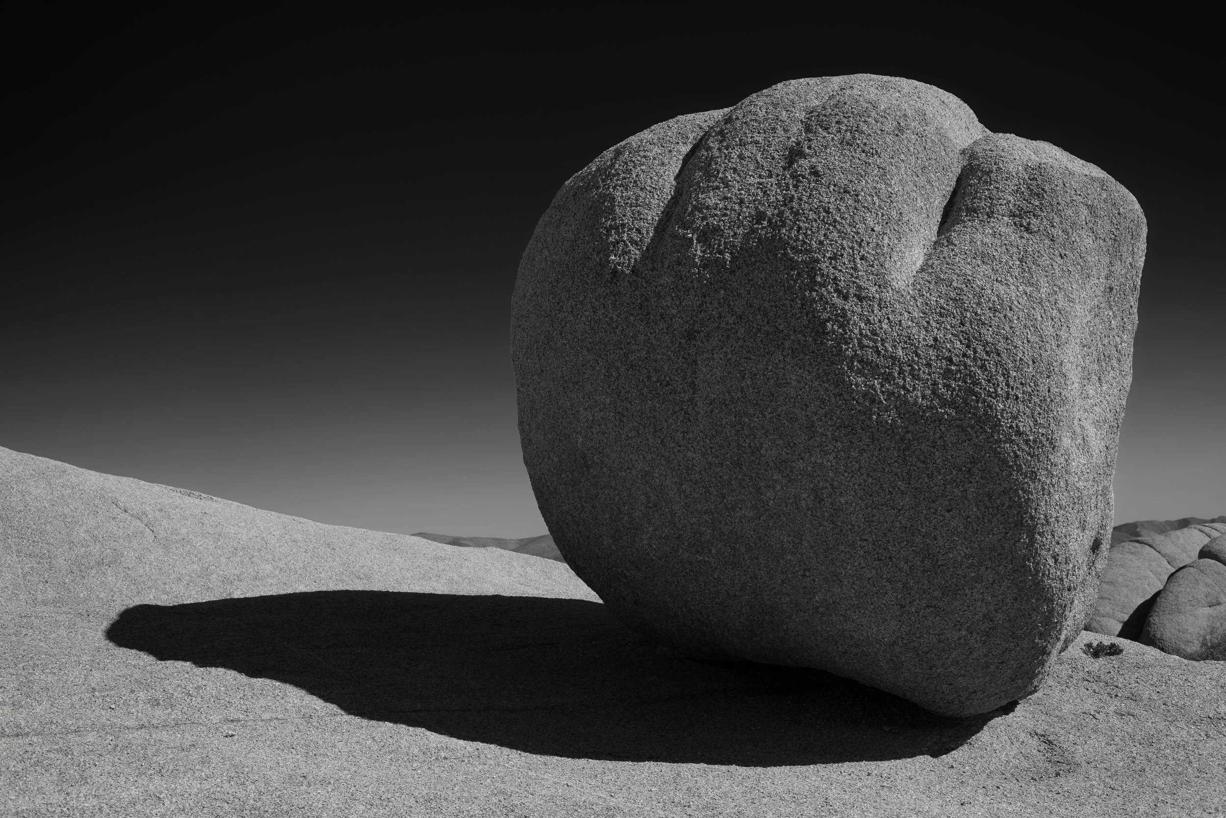 During the middle of the day I had a great time exploring a section of the national park called Jumbo Rocks. Lots of fun climbing around the granite rock formations in search of interesting shapes. I thought the light wrapping around this particular boulder which was balancing on an even bigger boulder made a nice composition. Choosing to convert to monochrome during post processing helps to focus on that composition as does using a red filter, which turns the blue sky almost black. Fujifilm X-Pro2 with a Fujinon XF 35mm f2 R WR, 1/900 @ f8.0, ISO 200 .
