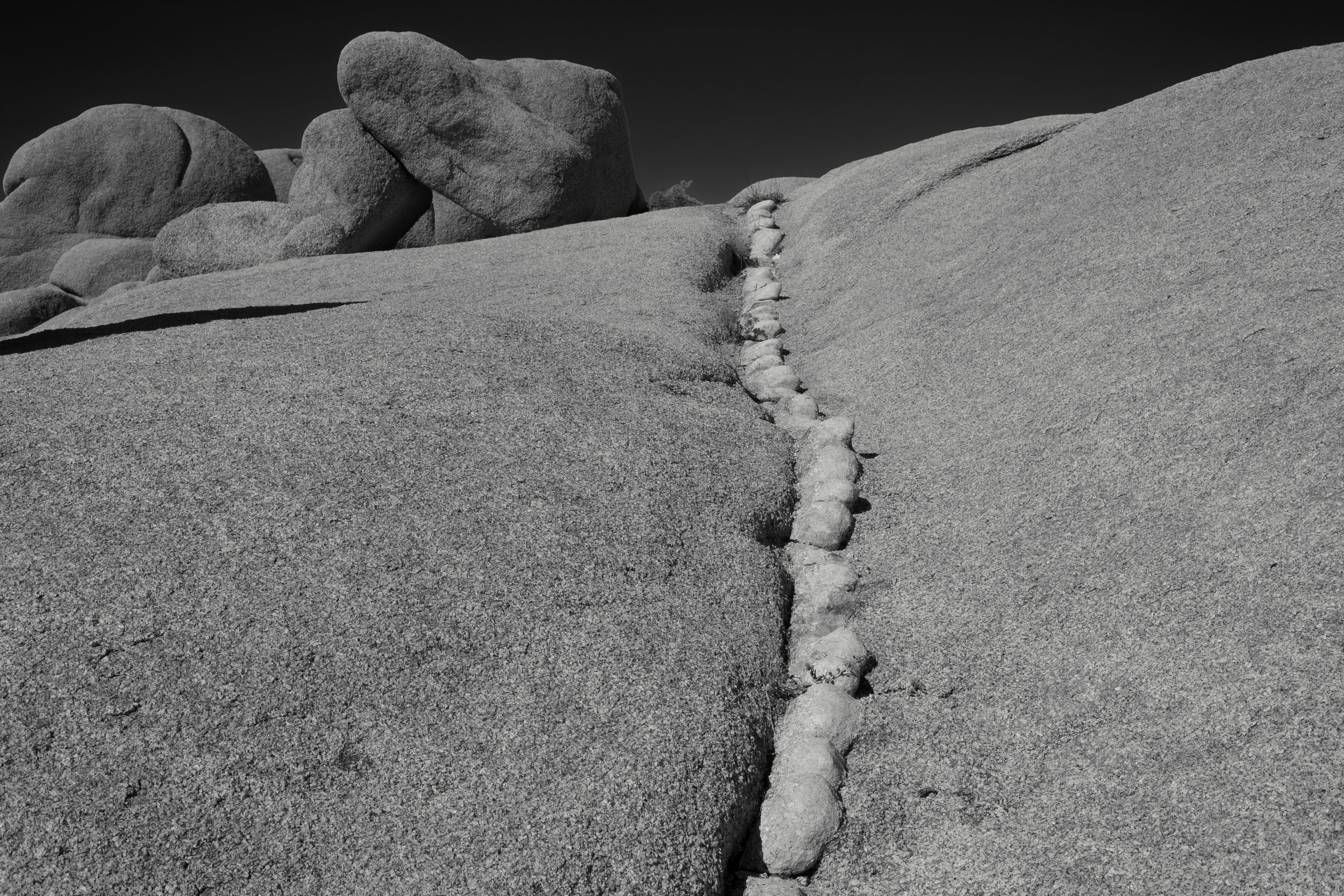 I kept noticing how these lines of a different type of rock made their way through the giant granite formations. In this case, I used the line to lead the viewer into the photo. Fujifilm X-Pro2 with a Fujinon XF 35mm f2 R WR, 1/680 @ f11, ISO 200 .