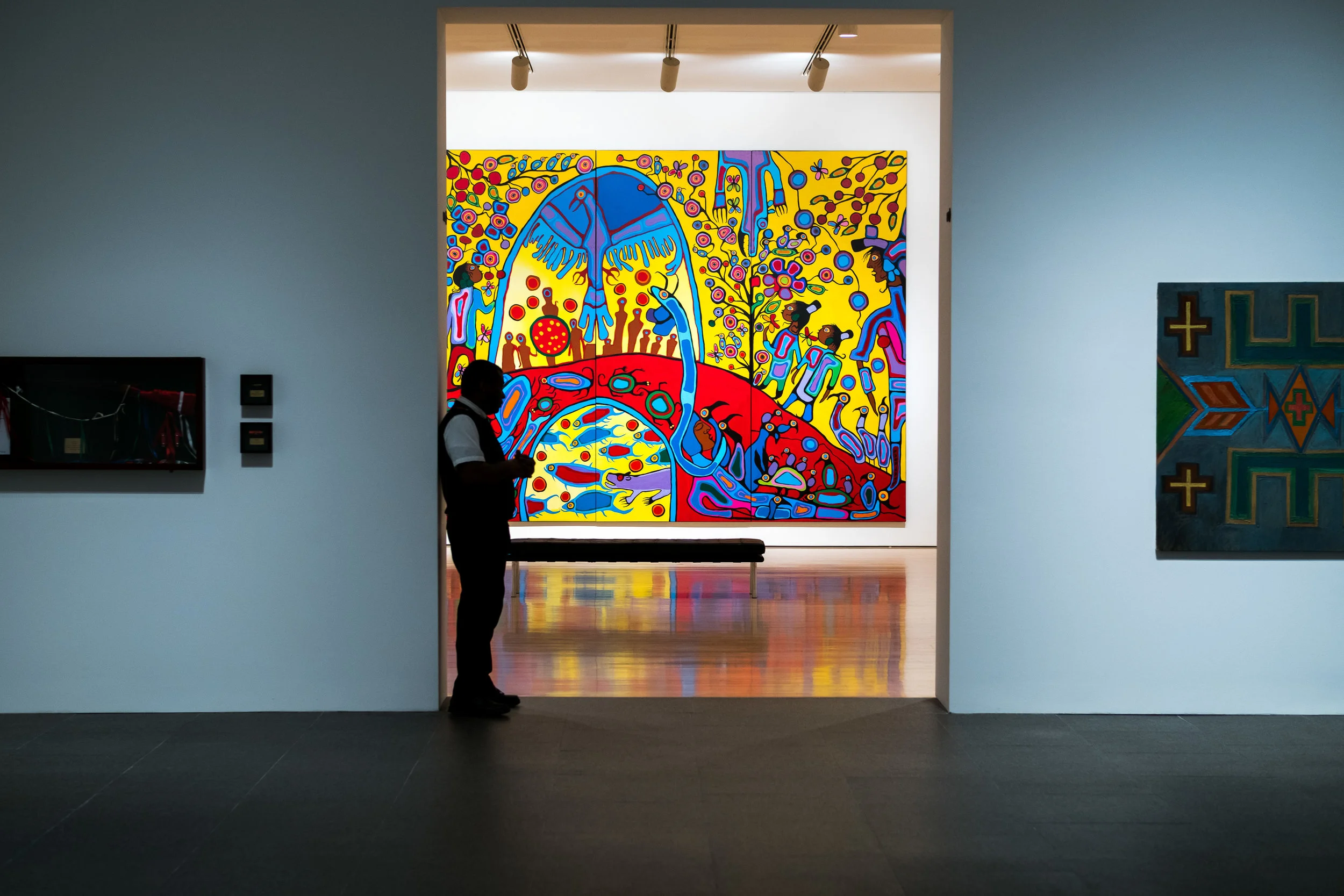 I use the pop of color and door frame to draw you into this photo taken at the National Gallery of Canada in Ottawa. The guard in the doorframe breaks up the scene and adds some life. Fujifilm X-Pro2 with a 50mm F2.0 lens, 1/40 @f2.8, ISO 320.