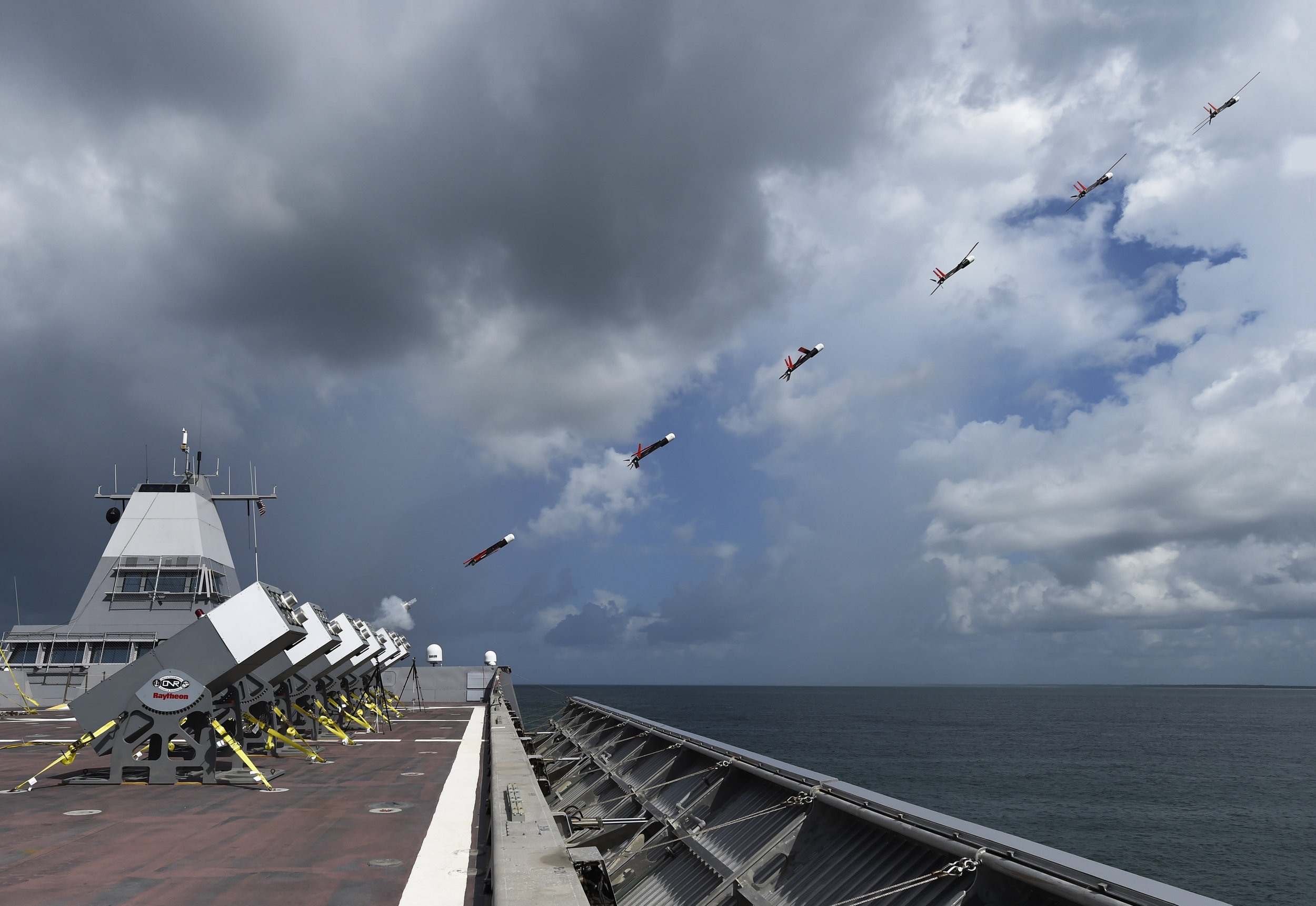  GULF OF MEXICO - A composite photograph shows Coyote unmanned air vehicles (UAVs) being launched in rapid succession from the deck of Sea Fighter (FSF 1) during an at-sea demonstration of the Office of Naval Research Low-cost UAV Swarming Technology