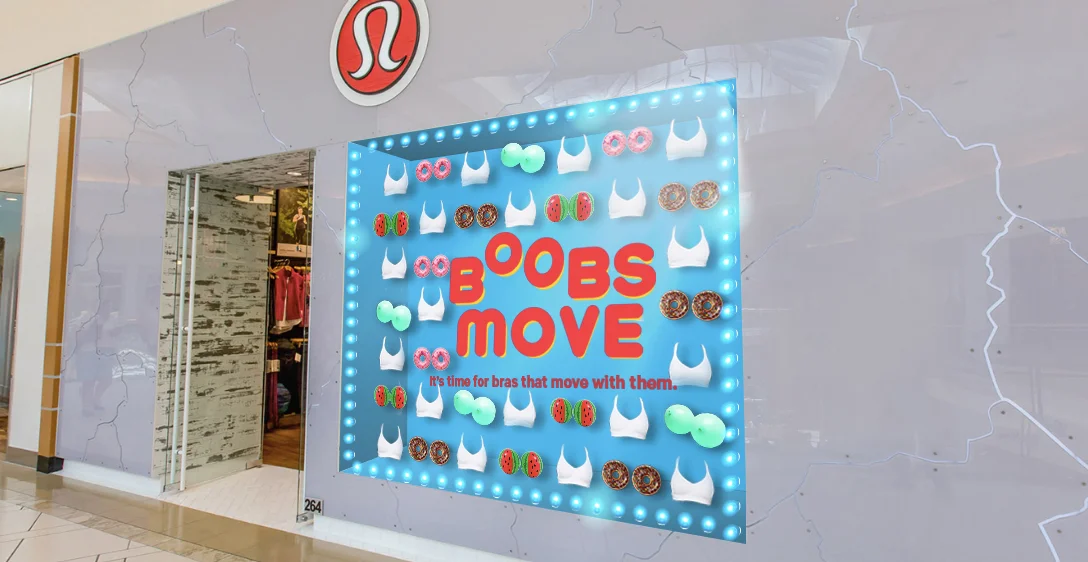 Tier 3 window display, showing hanging bras and boob-alike items.