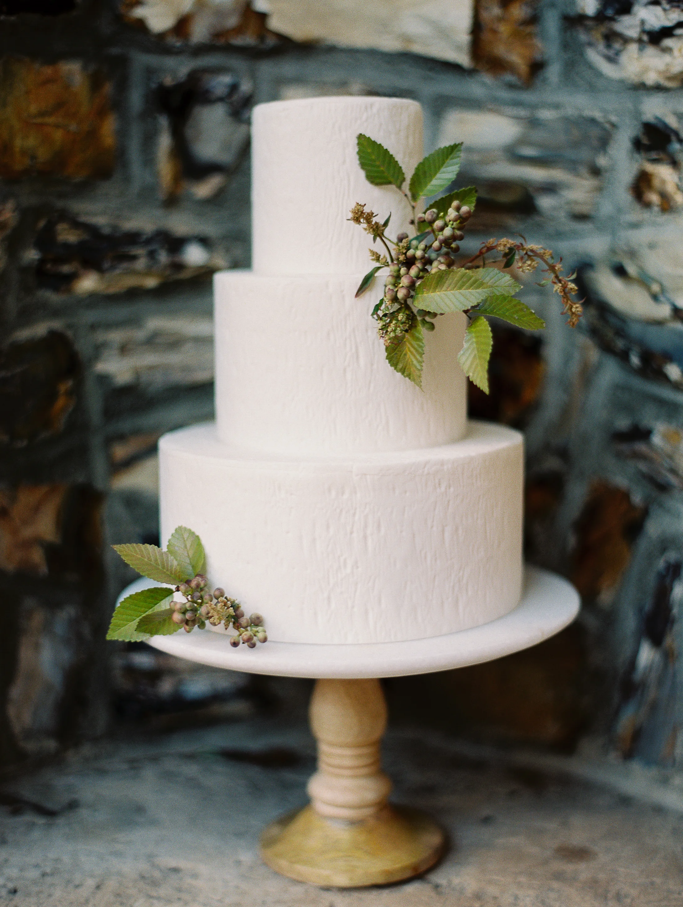 White textured cake with greenery