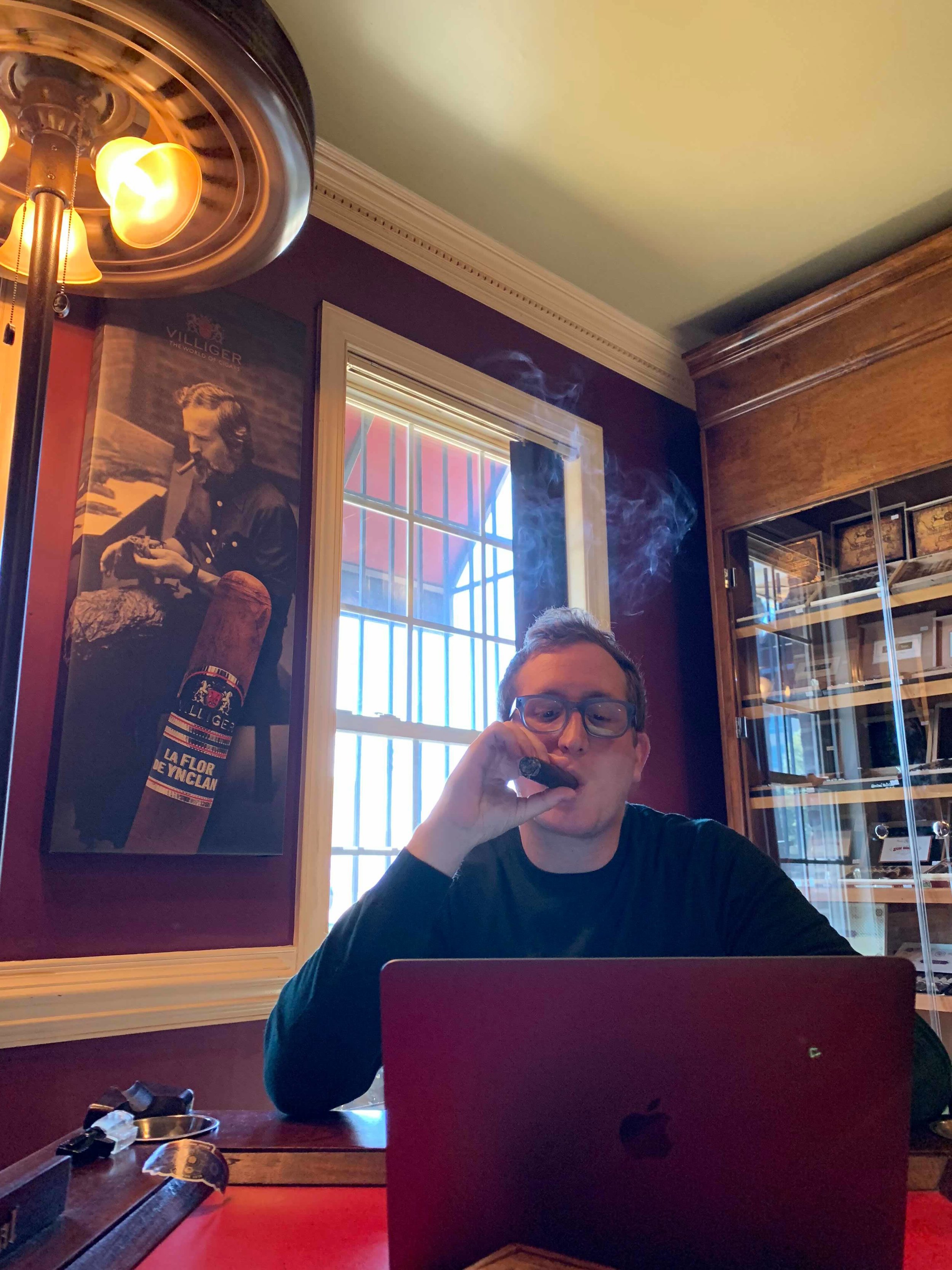 Still working, even in the cigar lounge!