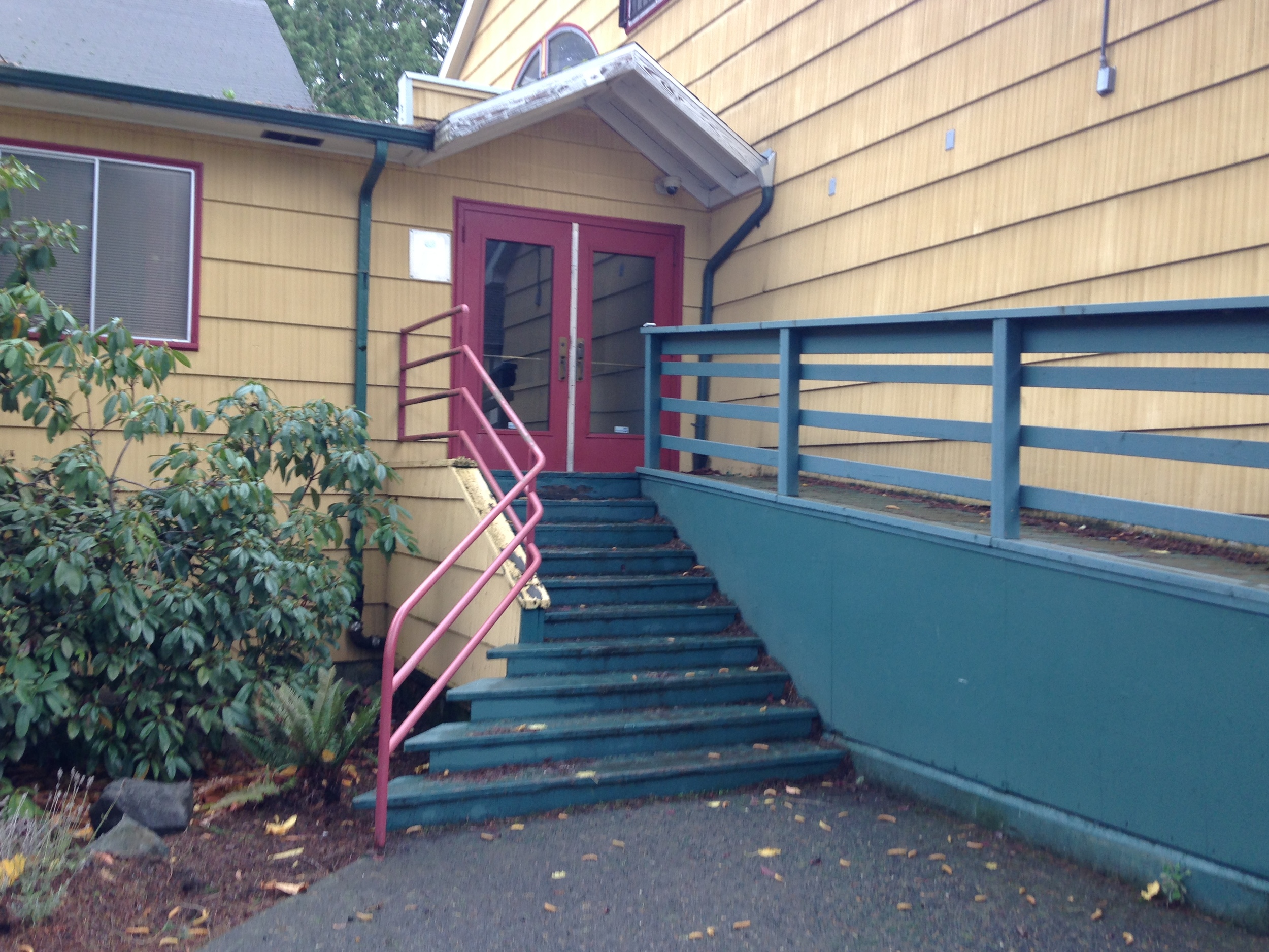 The existing building, which is soon to undergo Land Use Review, will feature accessibility upgrades throughout, including the primary entrance, pictured, which will receive new landscaping, stairs, and a revised ADA ramp.