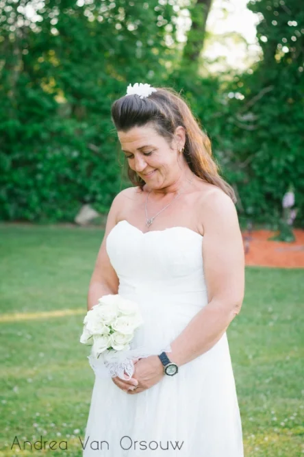 bride_looking_at_bouquet.jpg