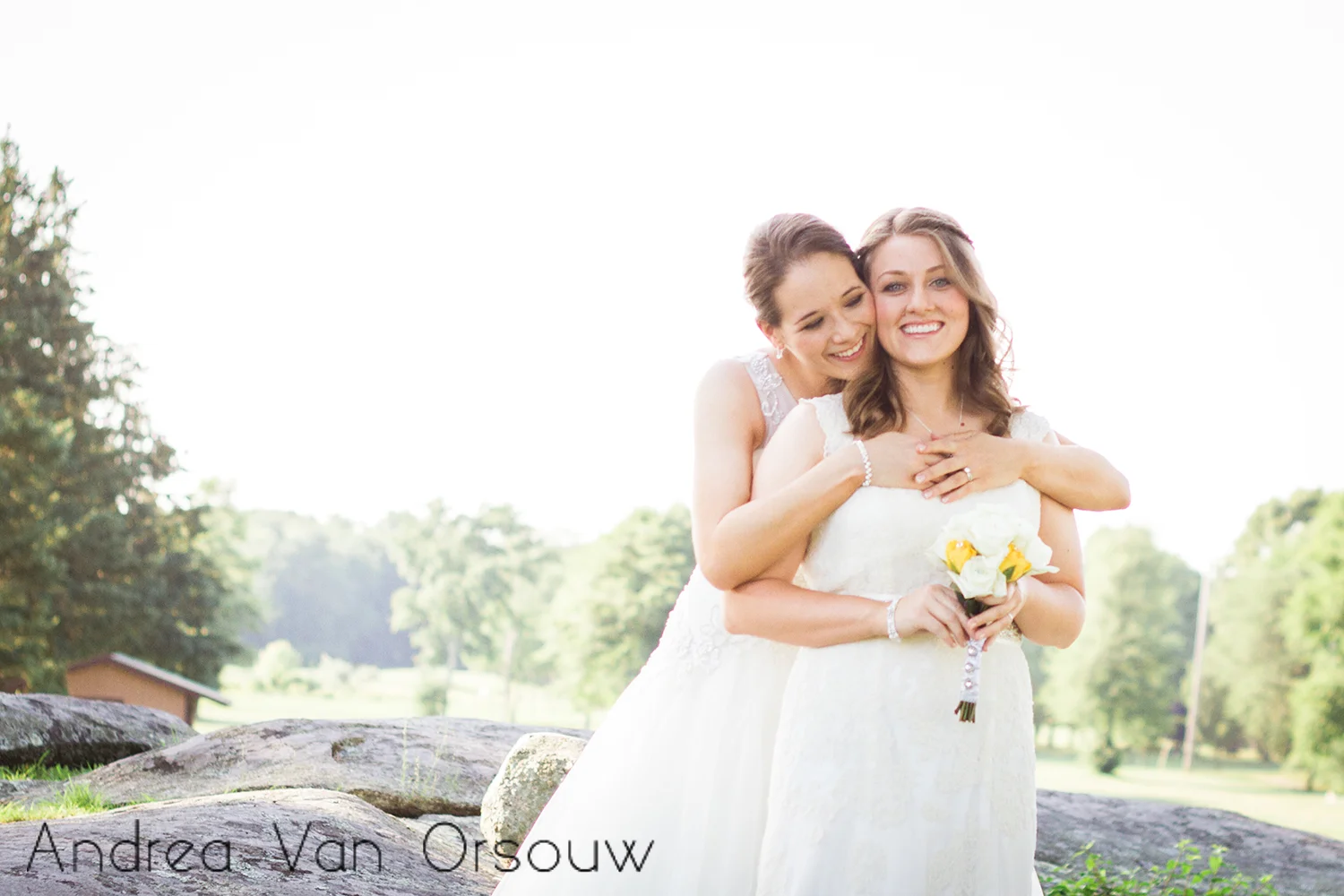 two_brides_bouquet_hug.jpg
