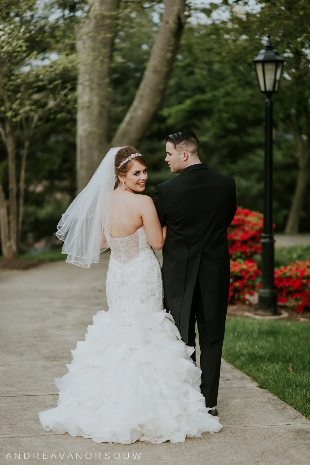 wedding_couple_bridal_portrait_over_shoulder_walking_pose_connecticut_wedding_photographer.jpg