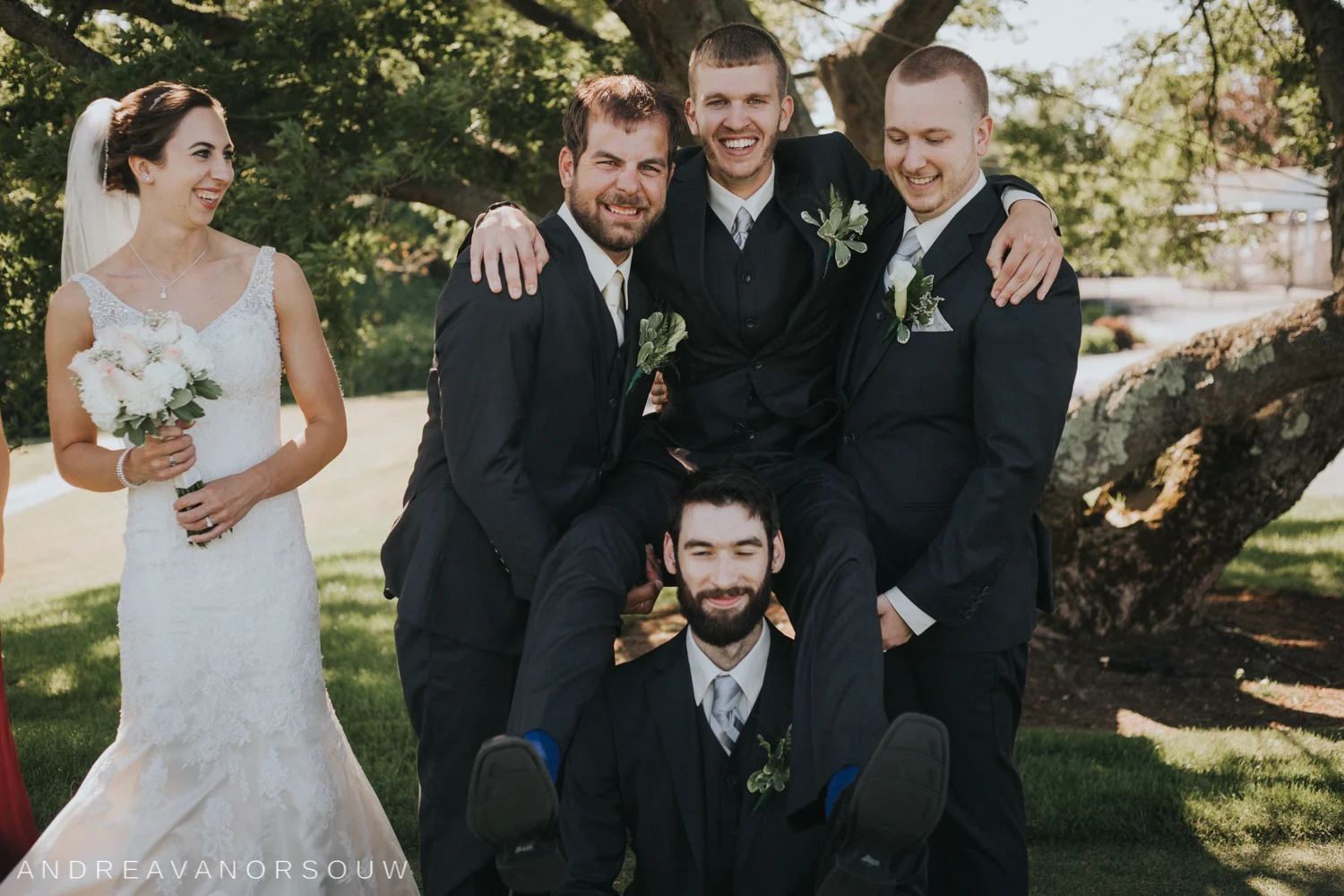 groomsmen_silly_funny_pose_wedding_bride_laughing_rhode_island_connecticut_new_england_weddings.jpg