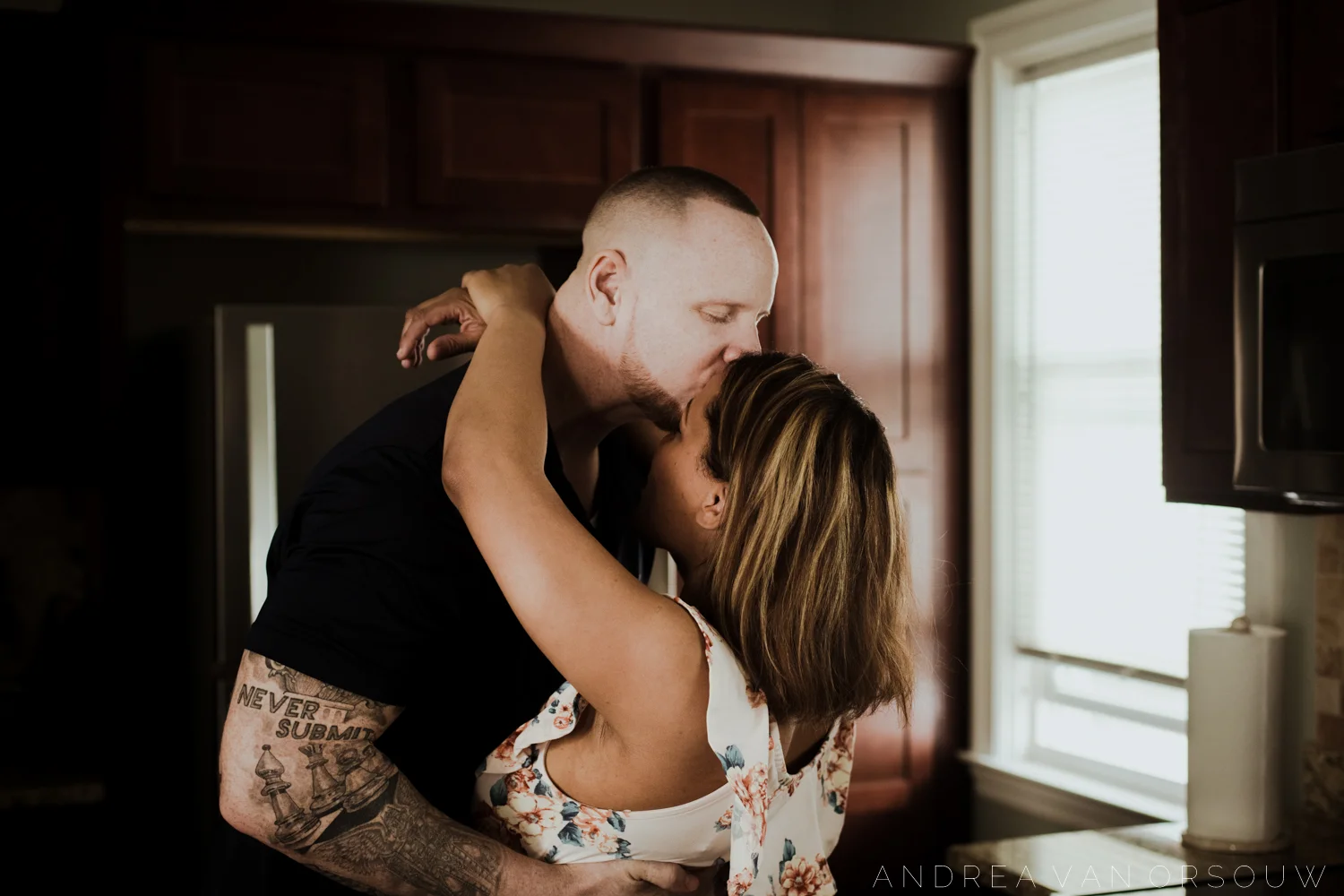 mom_dad_kiss_secret_moment_lifestyle_session_in-home_rhode_island_photographer_connecticut.jpg