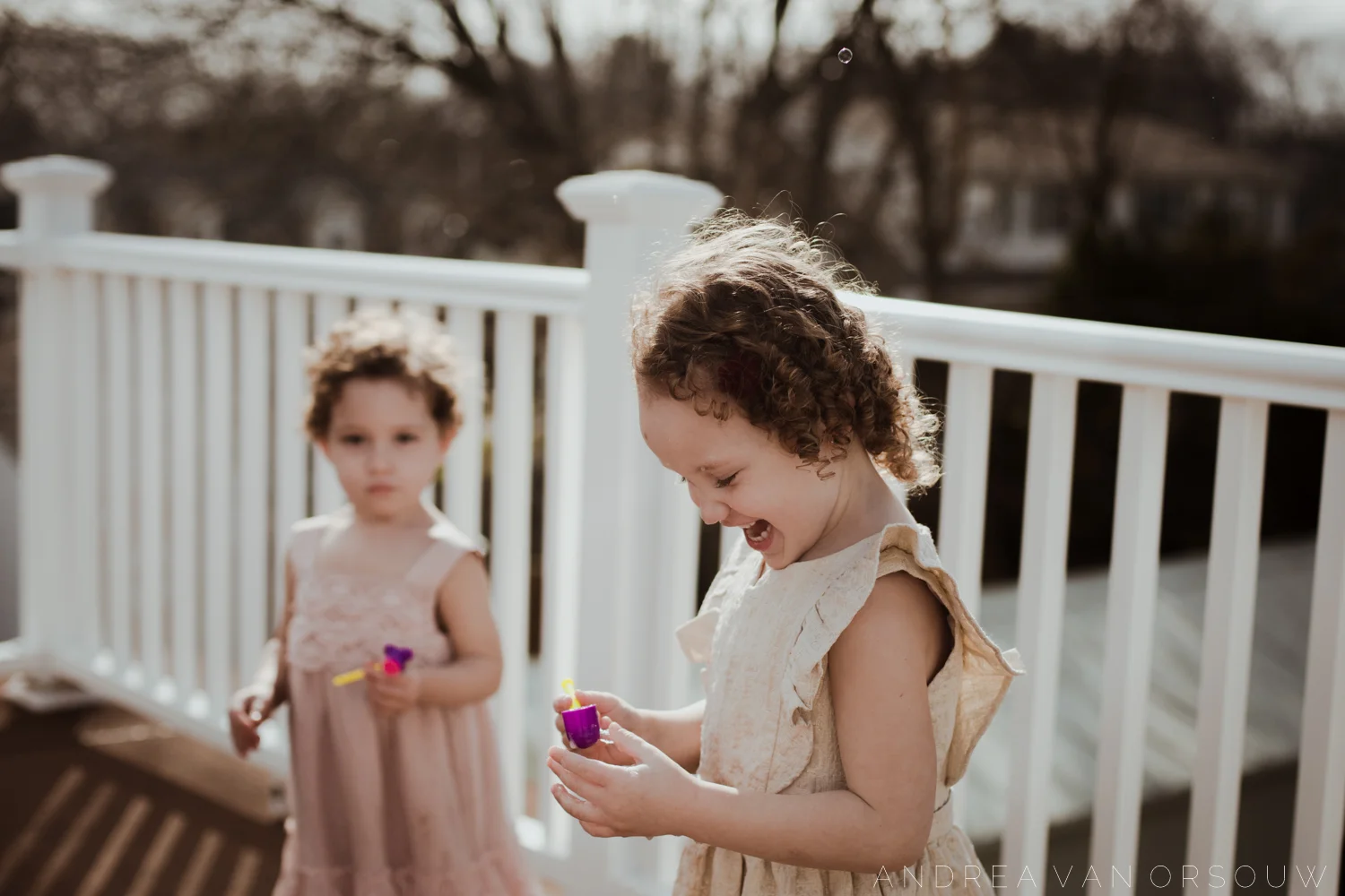 bubbles_outside_porch_lifestyle_session_fun_spring_new_england_wedding_photographer.jpg