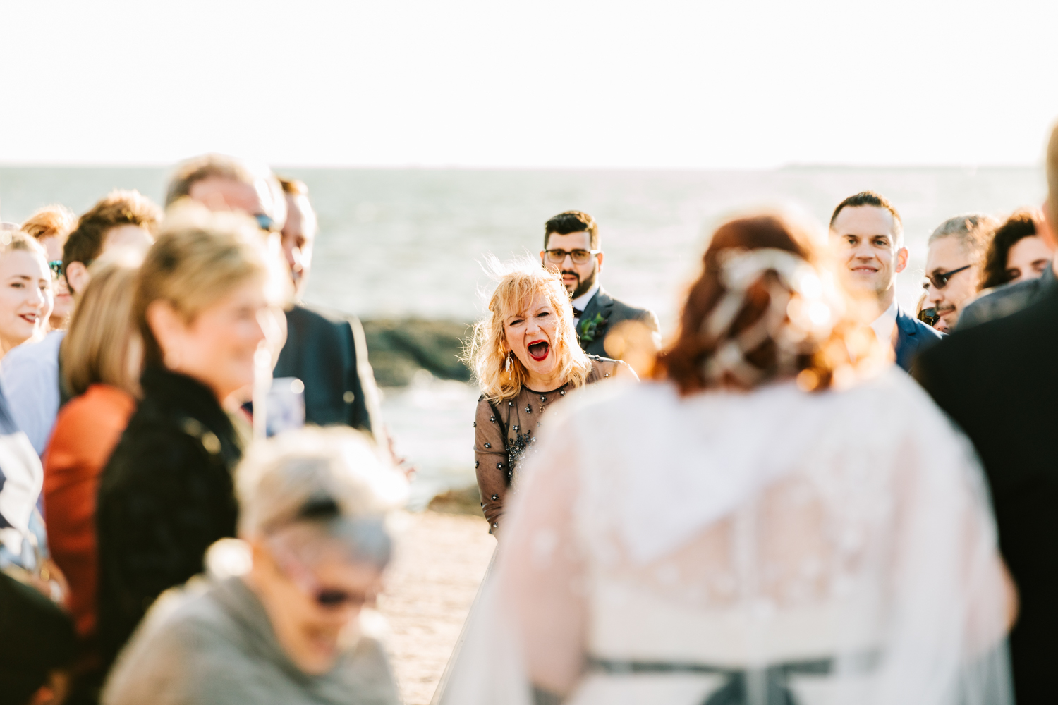 Bride's mother's reaction on beach wedding ceremony