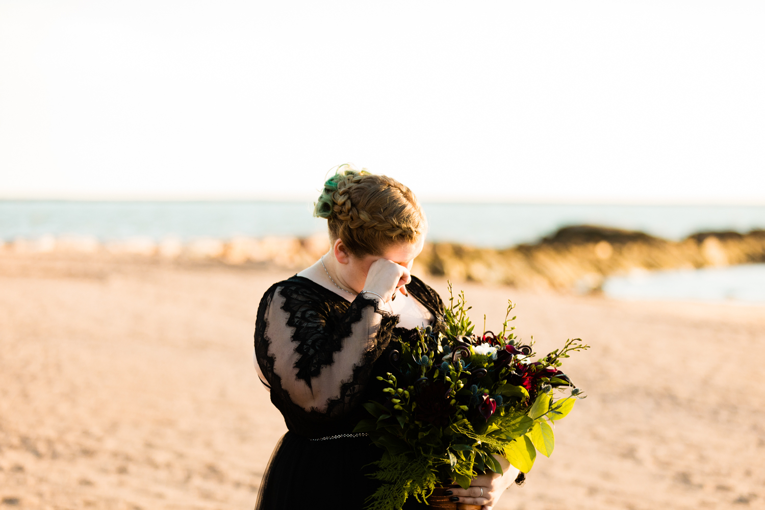 Emotional maid of honor crying at wedding ceremony