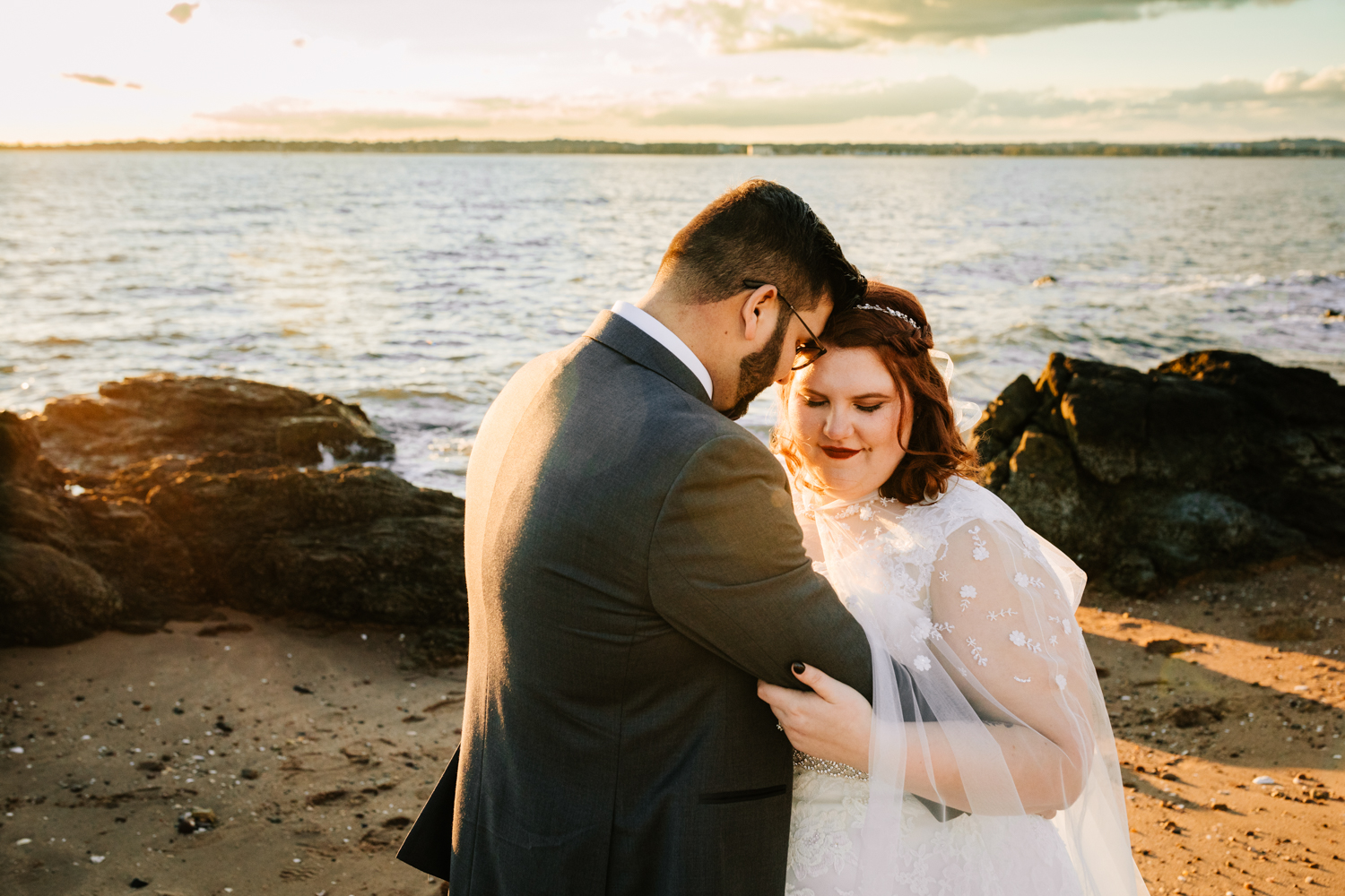 Red haired bride and groom on beach sunset wedding