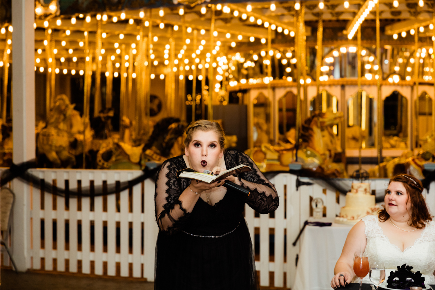 Maid of honor blowing on book for wedding day speech