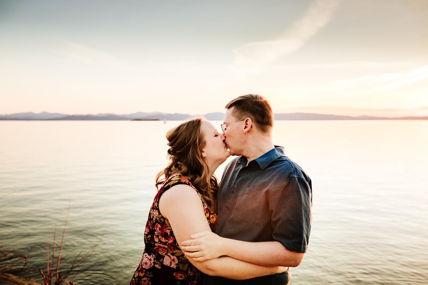 Couple kissing at lake in mountains