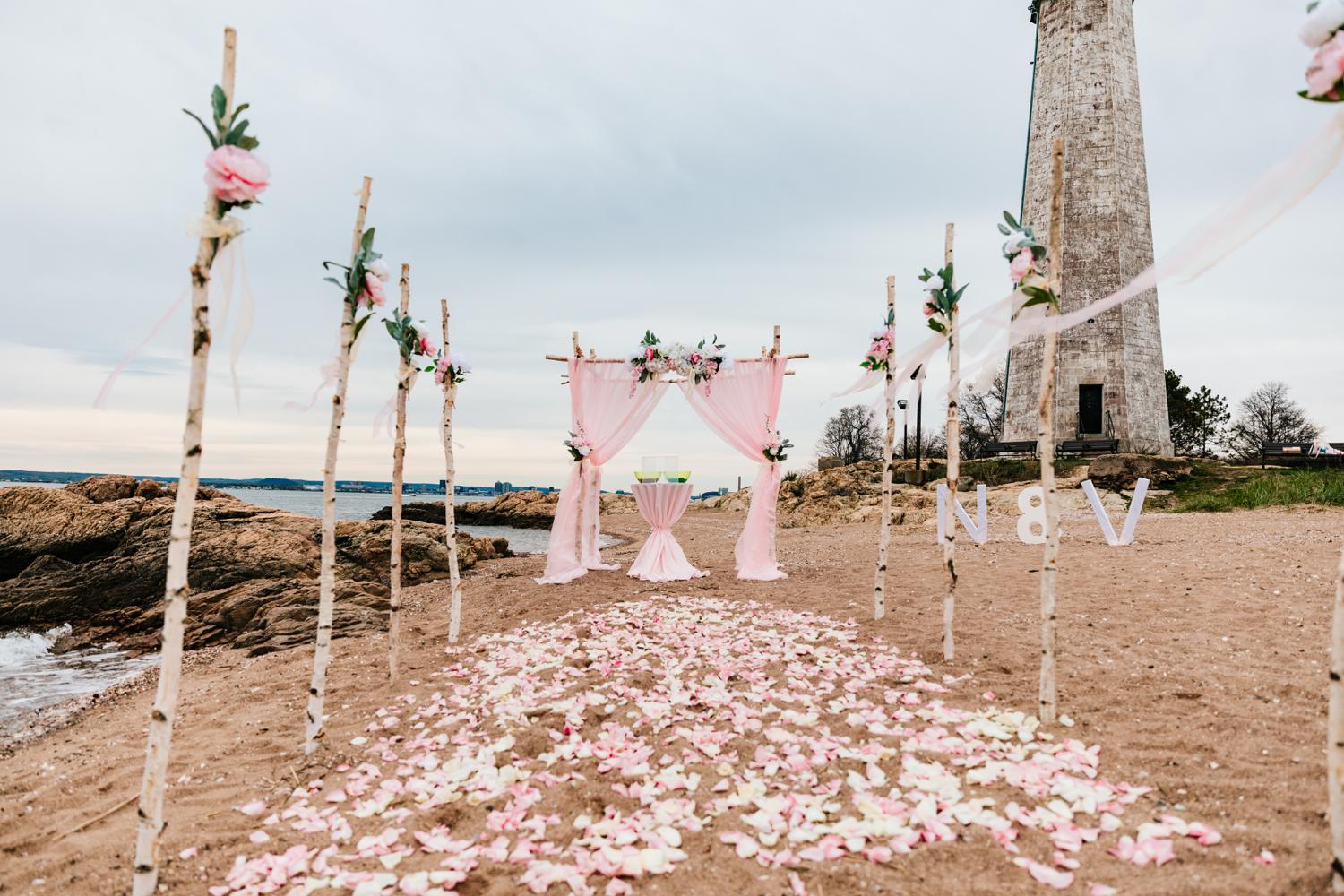 Beachy ceremony area for pink ocean wedding day