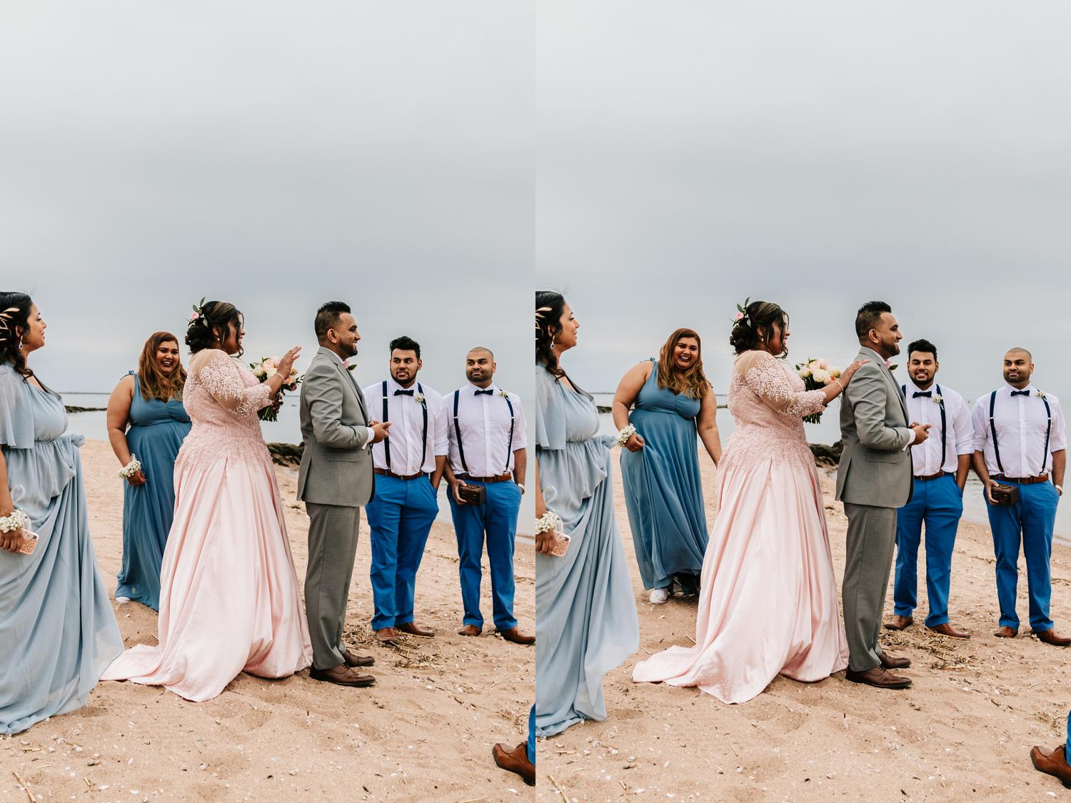 First look surrounded by bridal party on beach