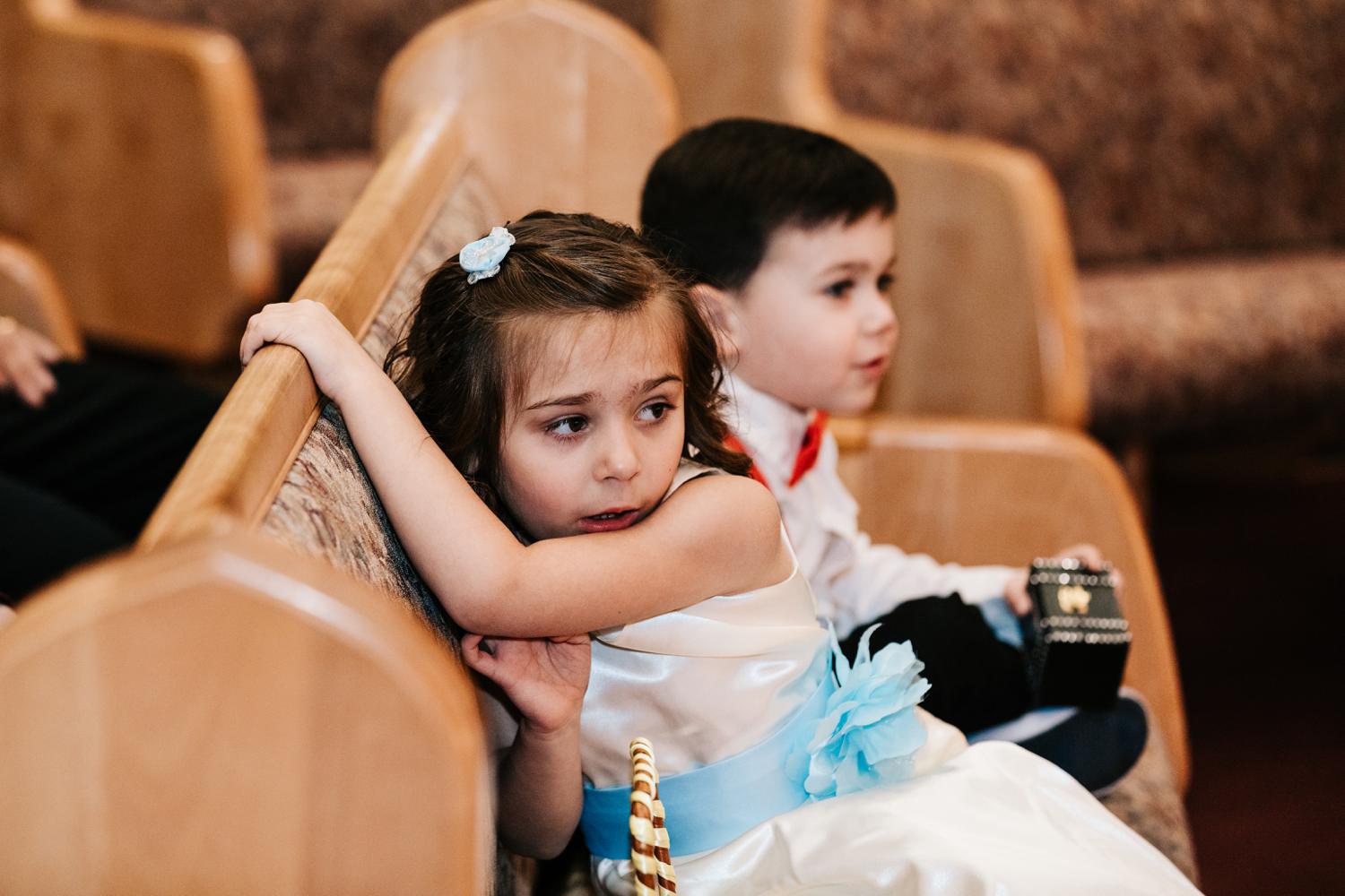 Bride's daughter looking on at wedding ceremony