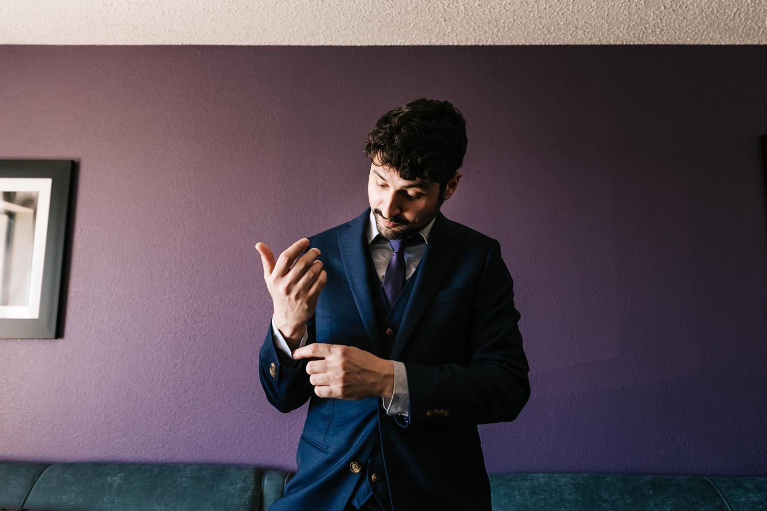 Groom in Navy Suit at El Paso Hotel