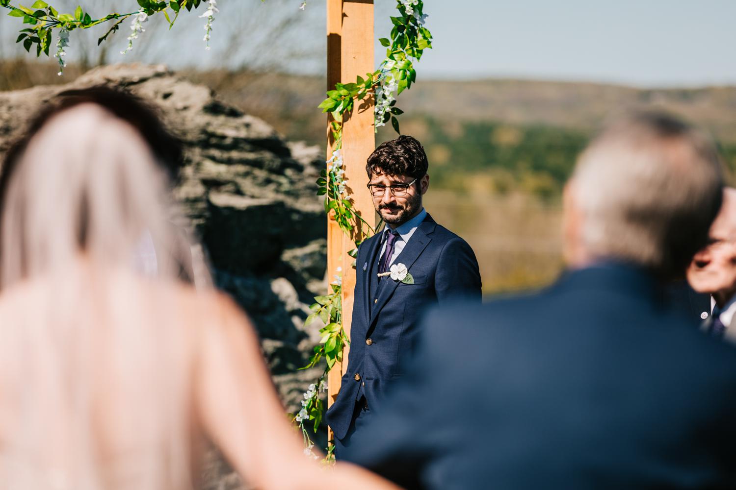 Groom seeing bride for first time during wedding ceremony in El Paso