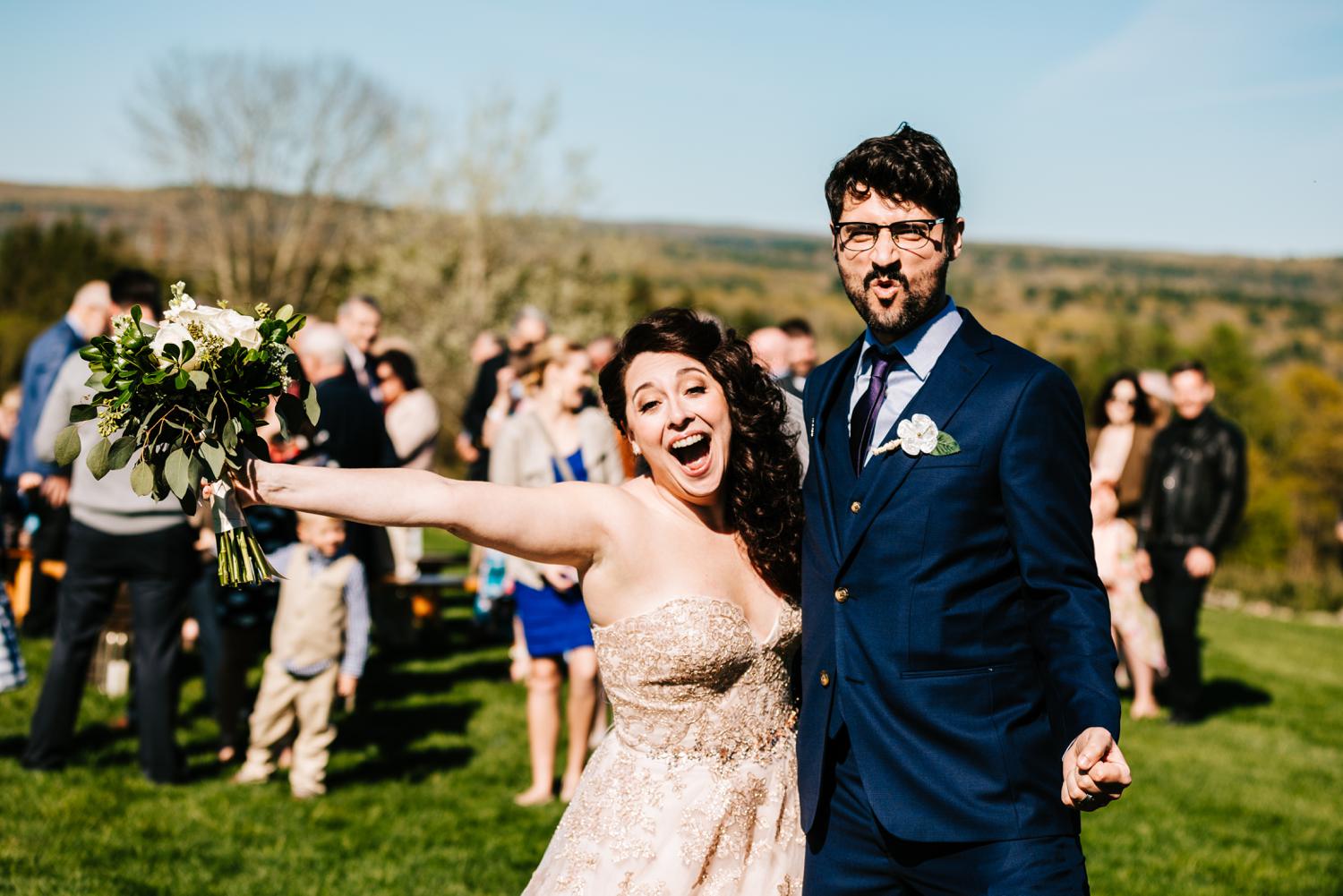 Bride and groom being goofy after wedding ceremony in Lubbock