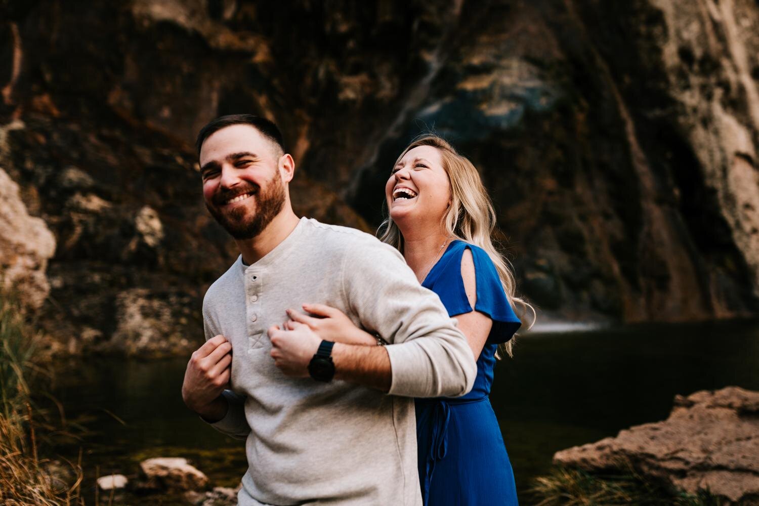 Couple laughing during engagement session in Carlsbad, New Mexico