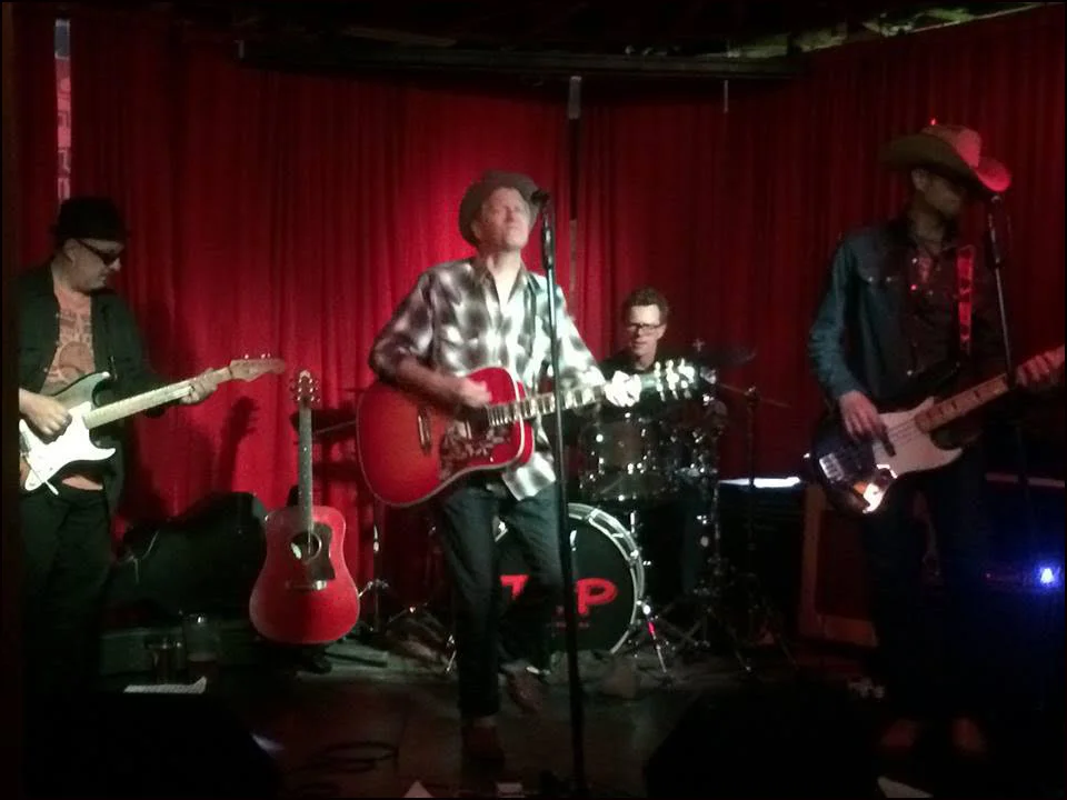 John Surge and The Haymakers. http://www.johnsurge.com/shows