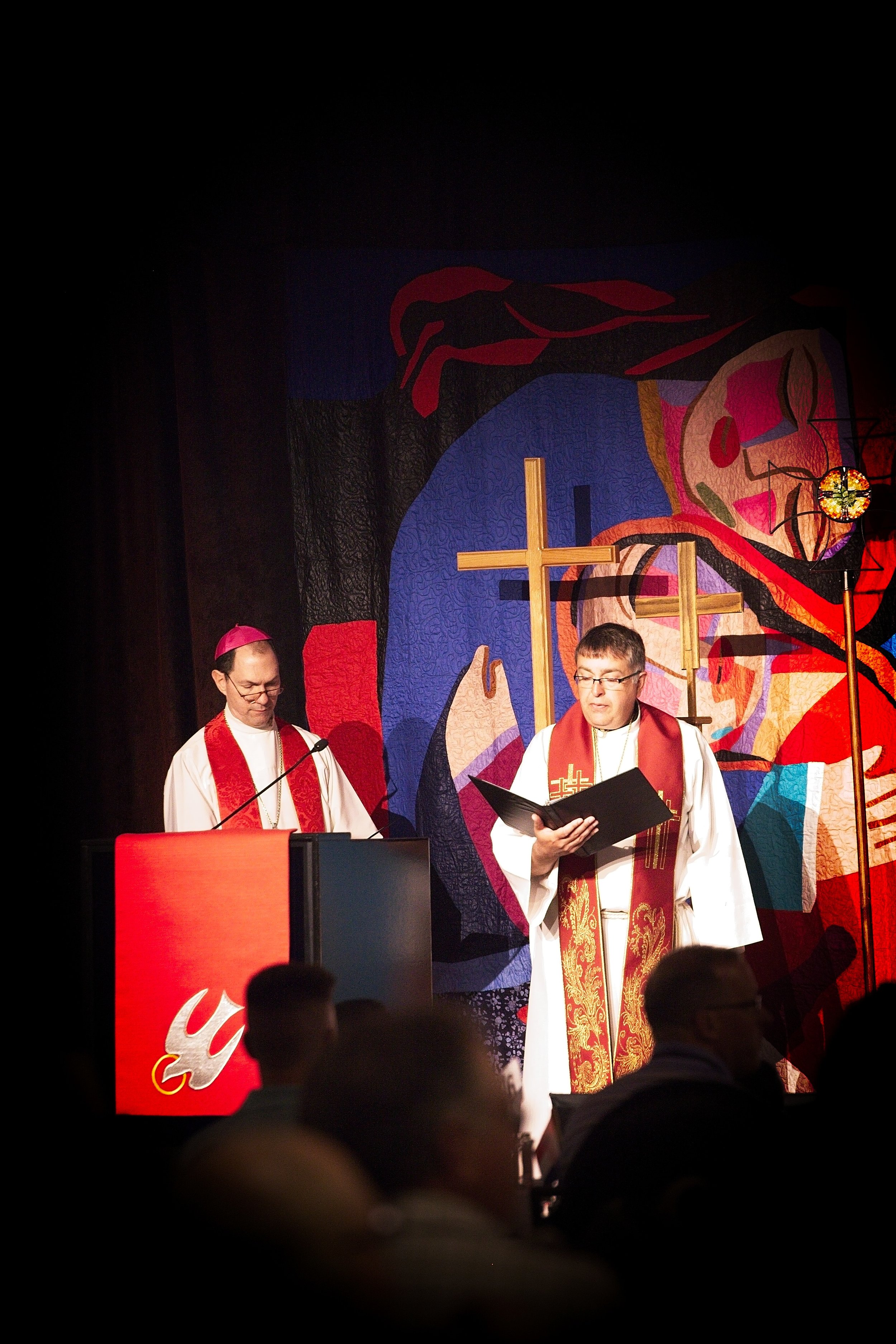 The Catholic Bishop and Lutheran Bishop, leading a service, together.