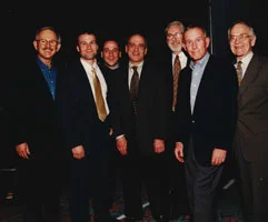 Dick and tom Smothers backstage with the crew from Marcus Advertising.