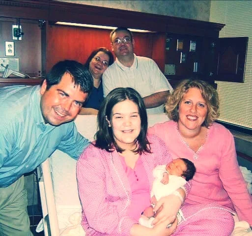 Kirsty, baby Parker, and Parker's adoptive parents.