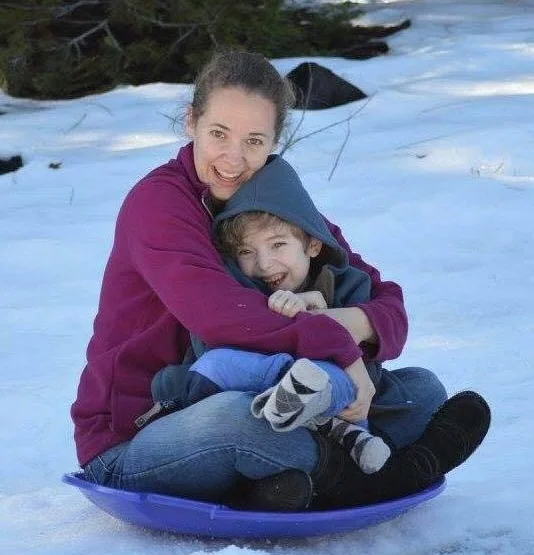 Kyle and his mom sledding just prior to his death.