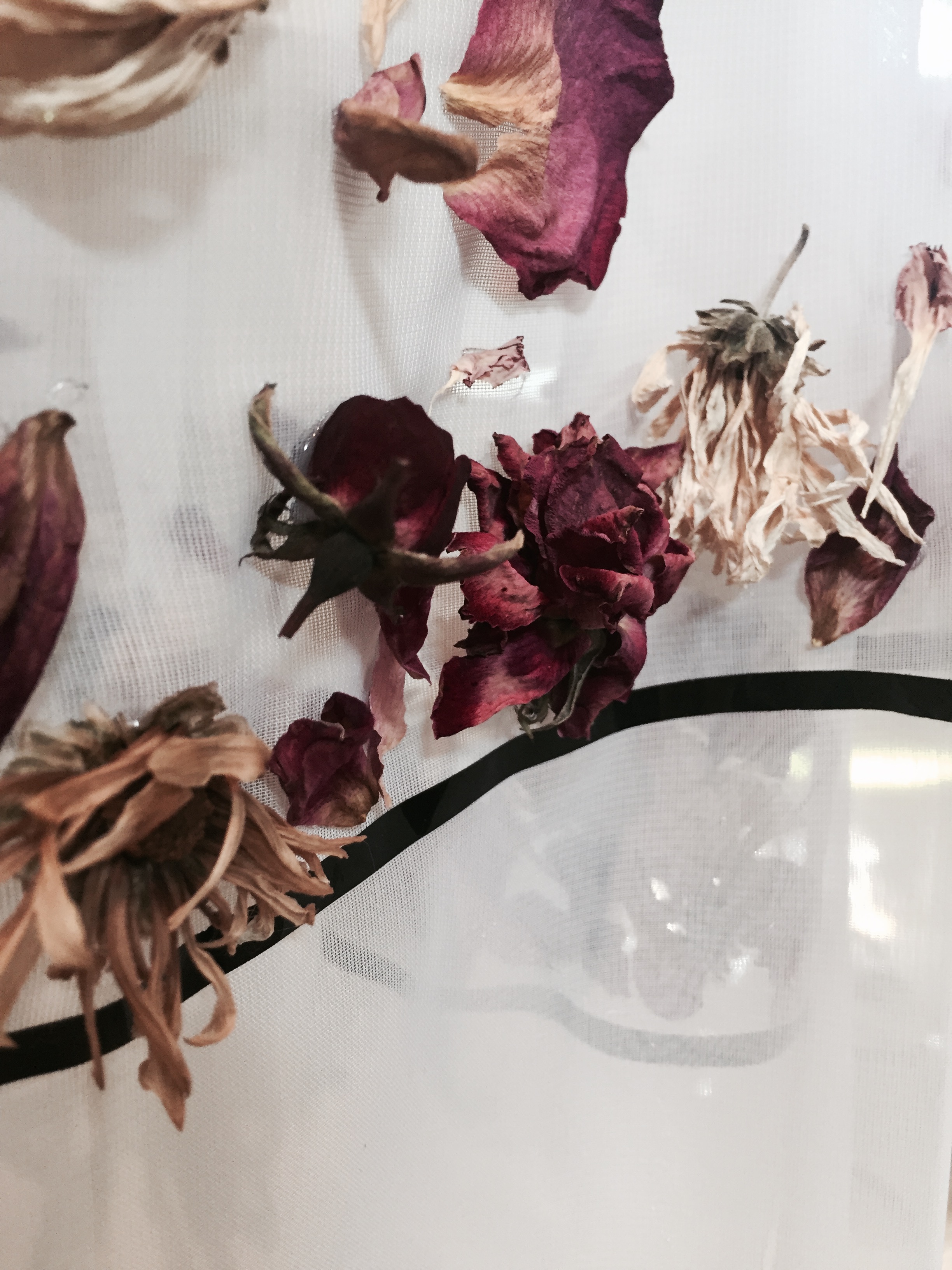 Dried flower detailing on a sheer skirt