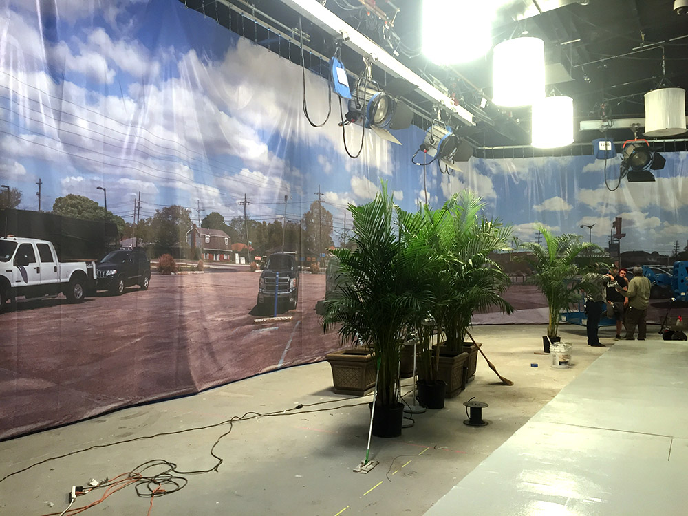 iPhone snap taken before stretching and lighting of the backing. The translight is 15'x117' and wraps around the whole set).