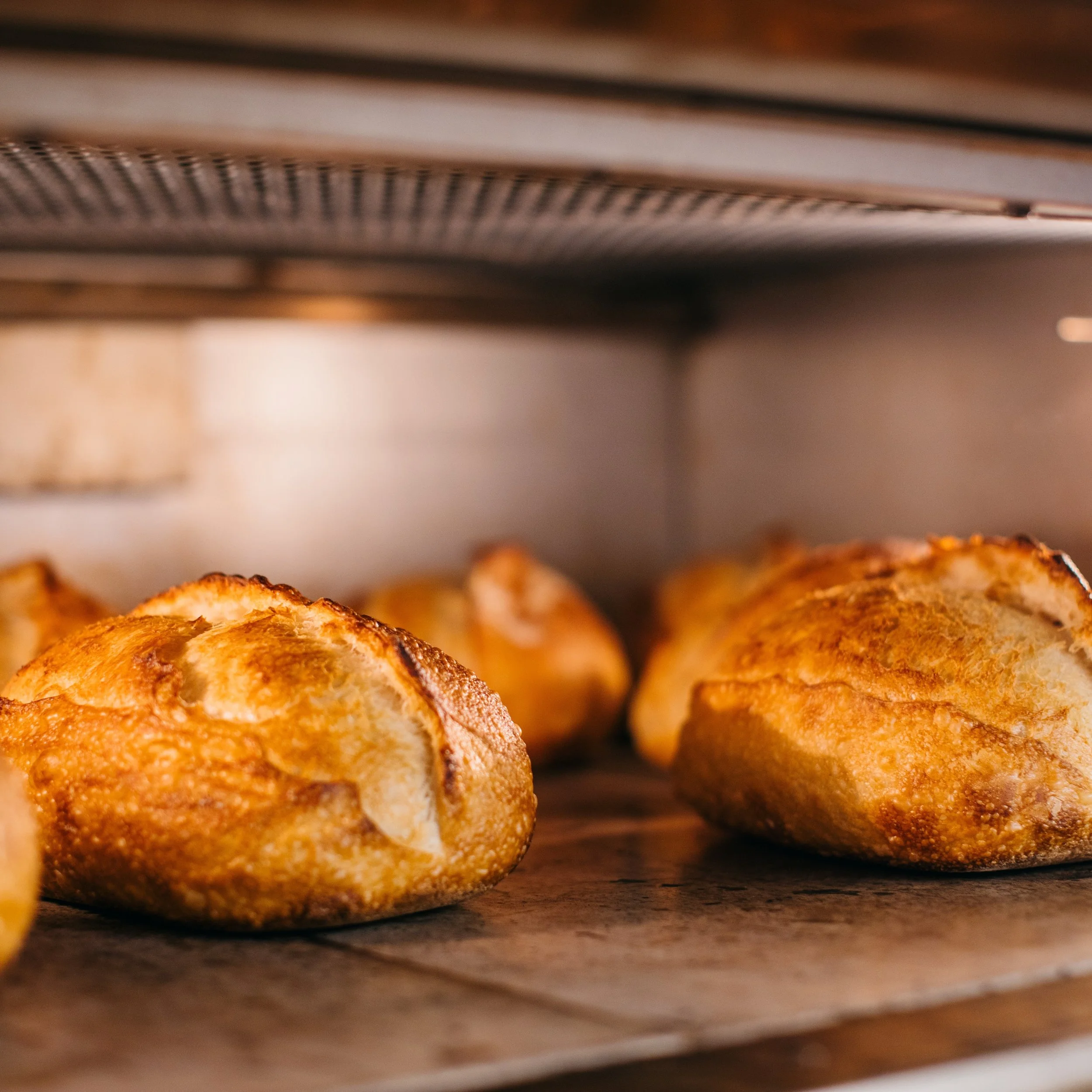 Every loaf we bake starts the same way: naturally fermented sourdough, no exceptions. All made by hand. Mixed, shaped, and proofed by hand over 48 hours &mdash; no shortcuts, no additives, just flour, water, salt, and time.