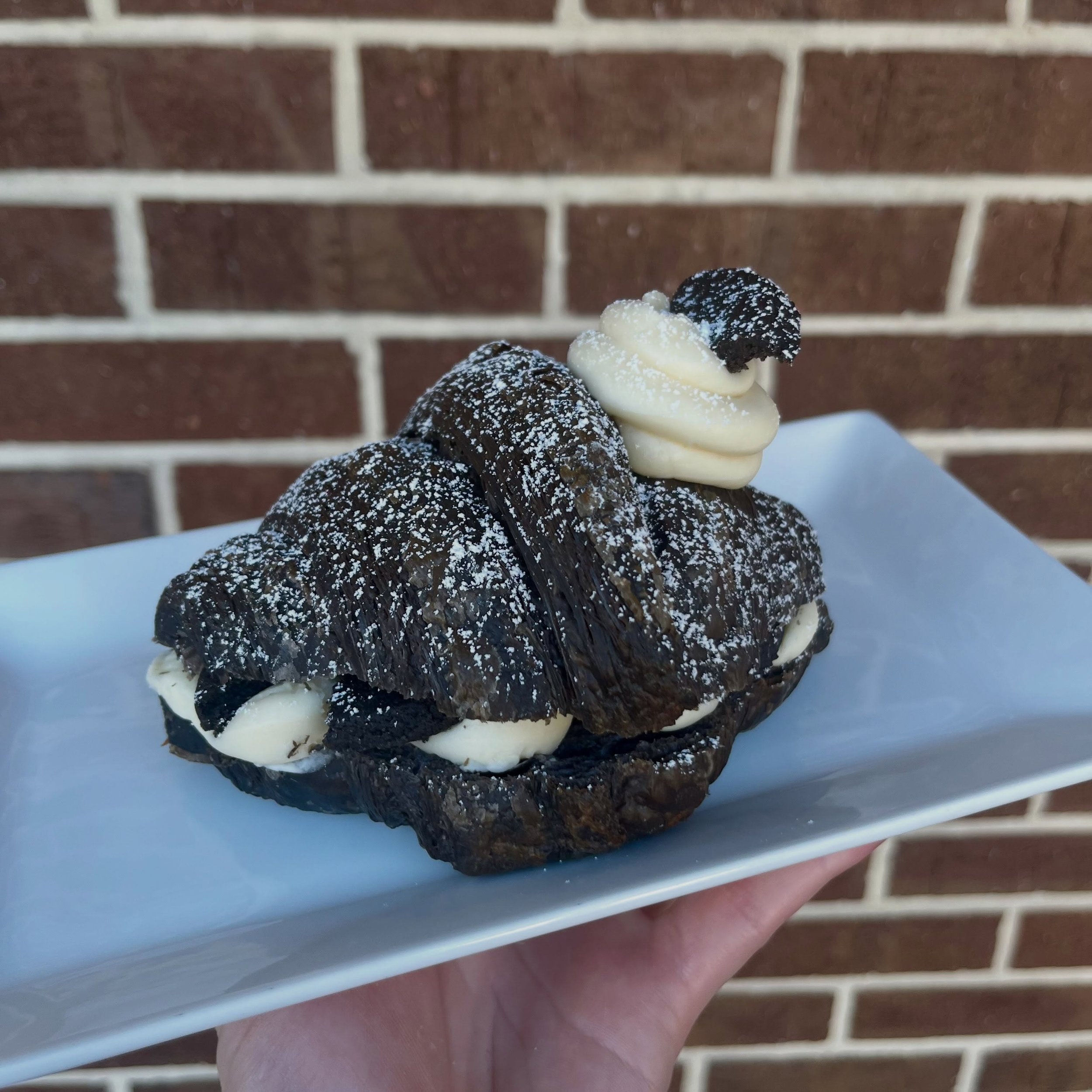 Introducing October&rsquo;s monthly croissant: the Cookies And Cream Croissant! 👻🖤

Let&rsquo;s break this guy down: first, the croissant is made with our black croissant dough using black out cocoa powder to give it a slightly chocolate-y taste. T