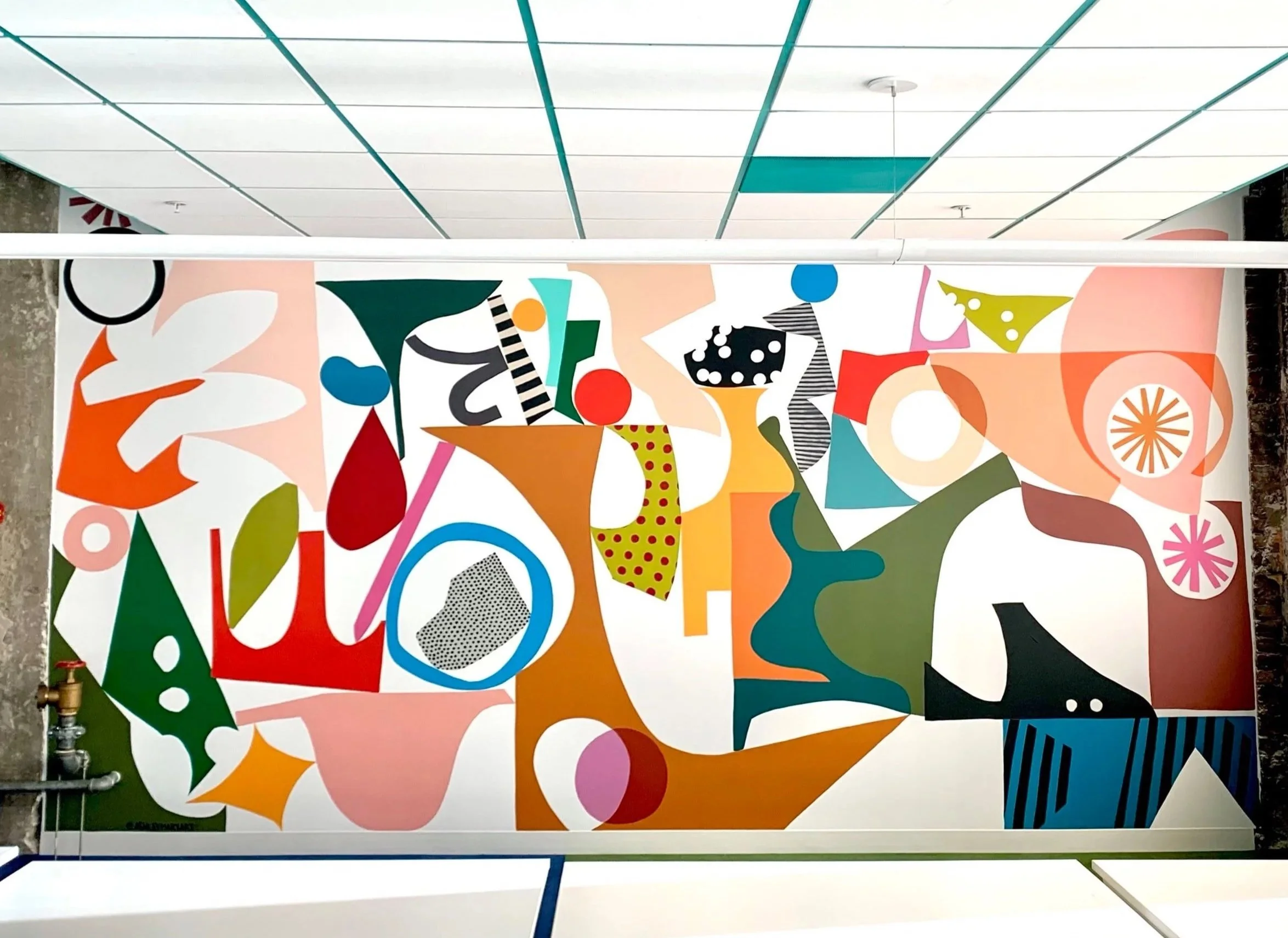 Large-scale abstract office mural by Ashley Mary at Figma San Francisco, featuring organic collage shapes and a vibrant, playful color palette.