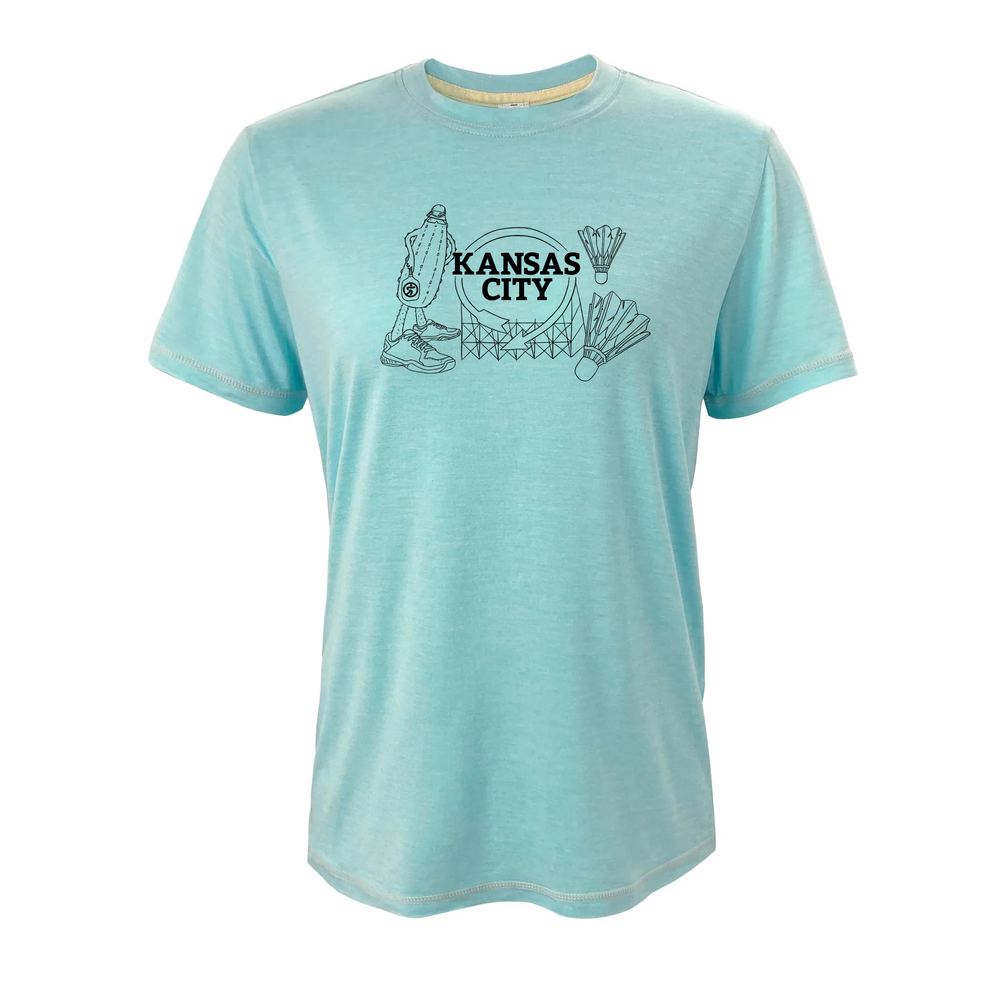 Pickle holding pickleball paddle in front of a Kansas City sign with shuttlecocks to the right.