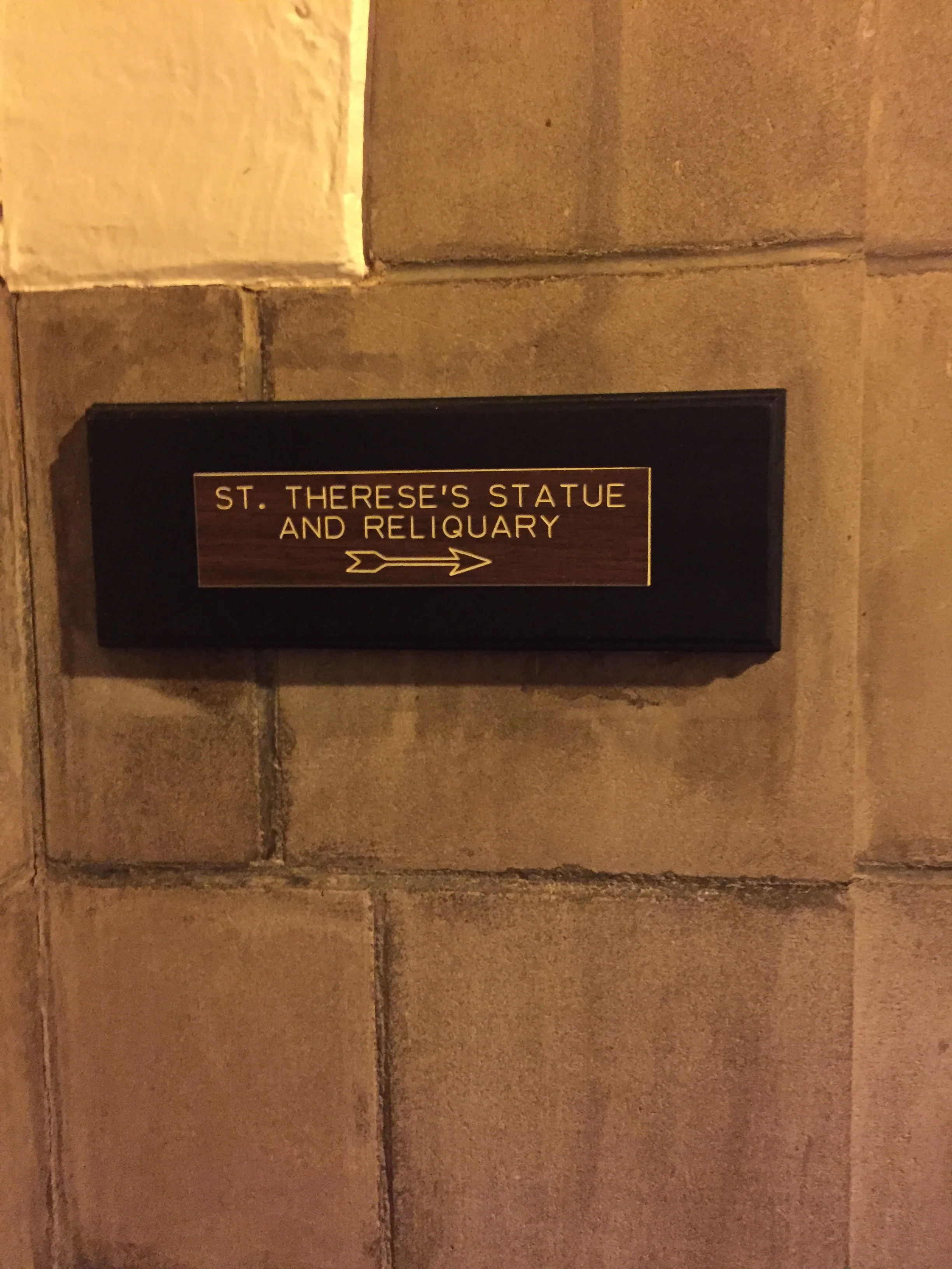 A sign directing you to St. Therese's reliquary, St. Therese retreat house, Columbus, OH. 