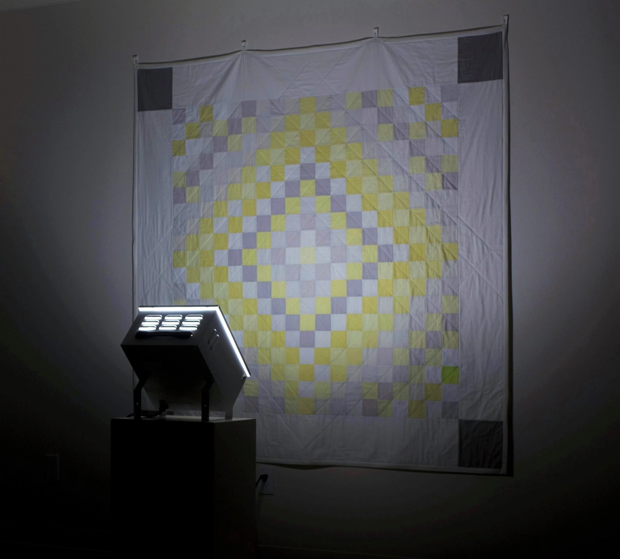 Sunshine and Shadow (Winter Quilt) , hand-dyed using Alaskan wildflowers and berries, hand-pieced and hand-quilted cotton, glow-in-the-dark thread, SAD light, 74" x 74" x 3', 2015