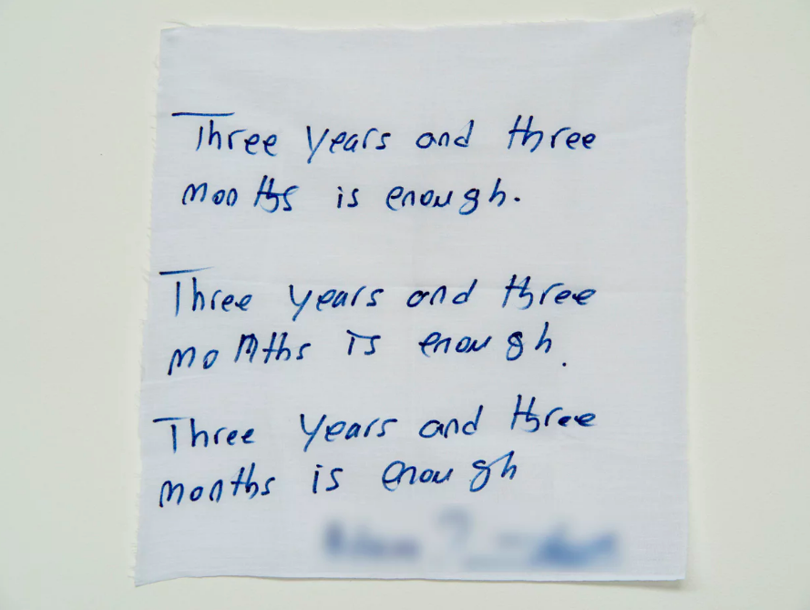 ‘Three years and three months is enough’: a handwritten note from a detainee on Manus Island. Photograph: David T Young/ Penny Ryan
